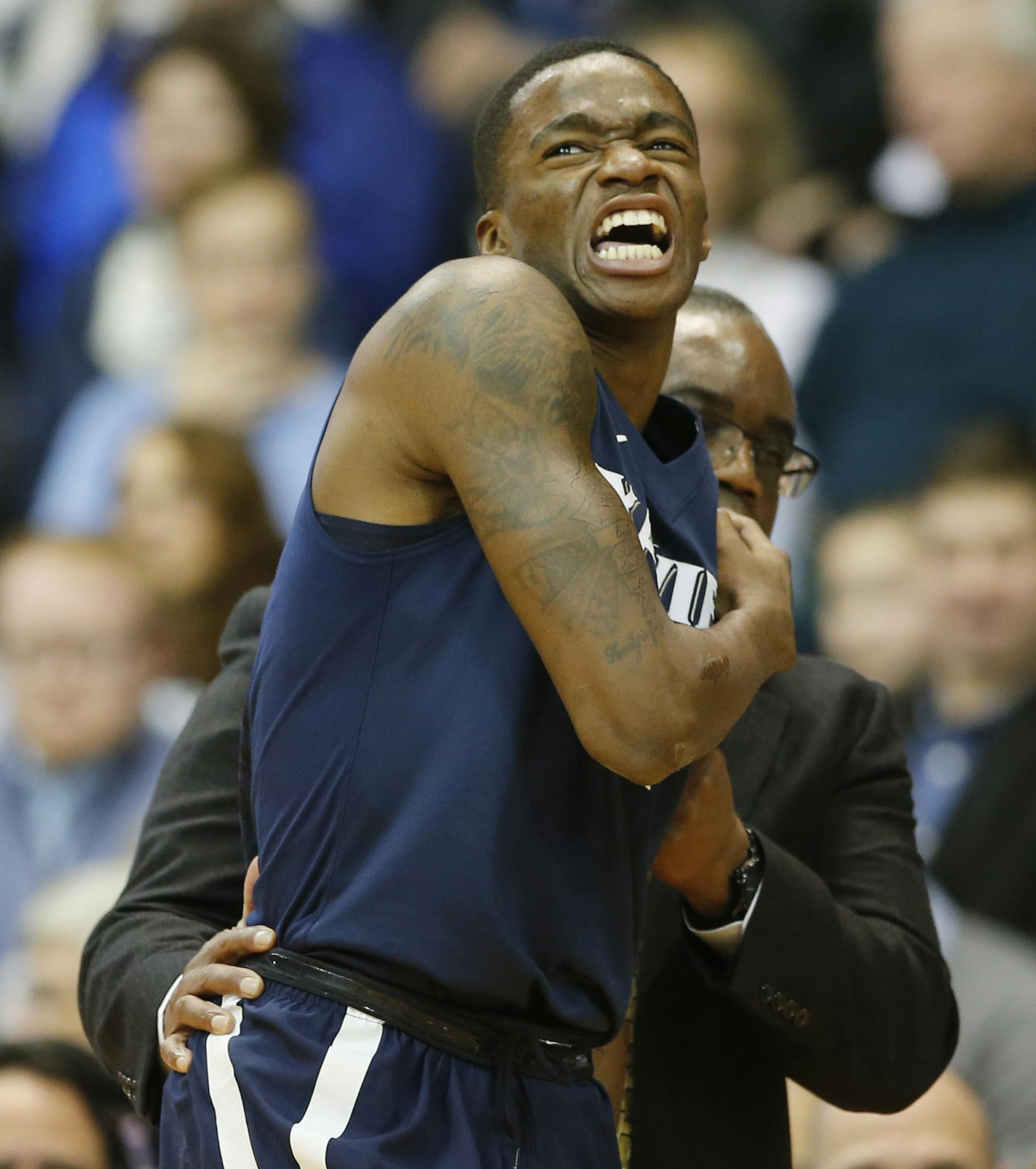 Xavier's Edmond Sumner grabs his shoulder in pain as he is helped off the court during the first half against Villanova at the Pavilion in Villanova, Pa., on Tuesday, Jan. 10, 2017. Sumner returned to the game. (Charles Fox/Philadelphia Inquirer/TNS) ORG XMIT: 1195880