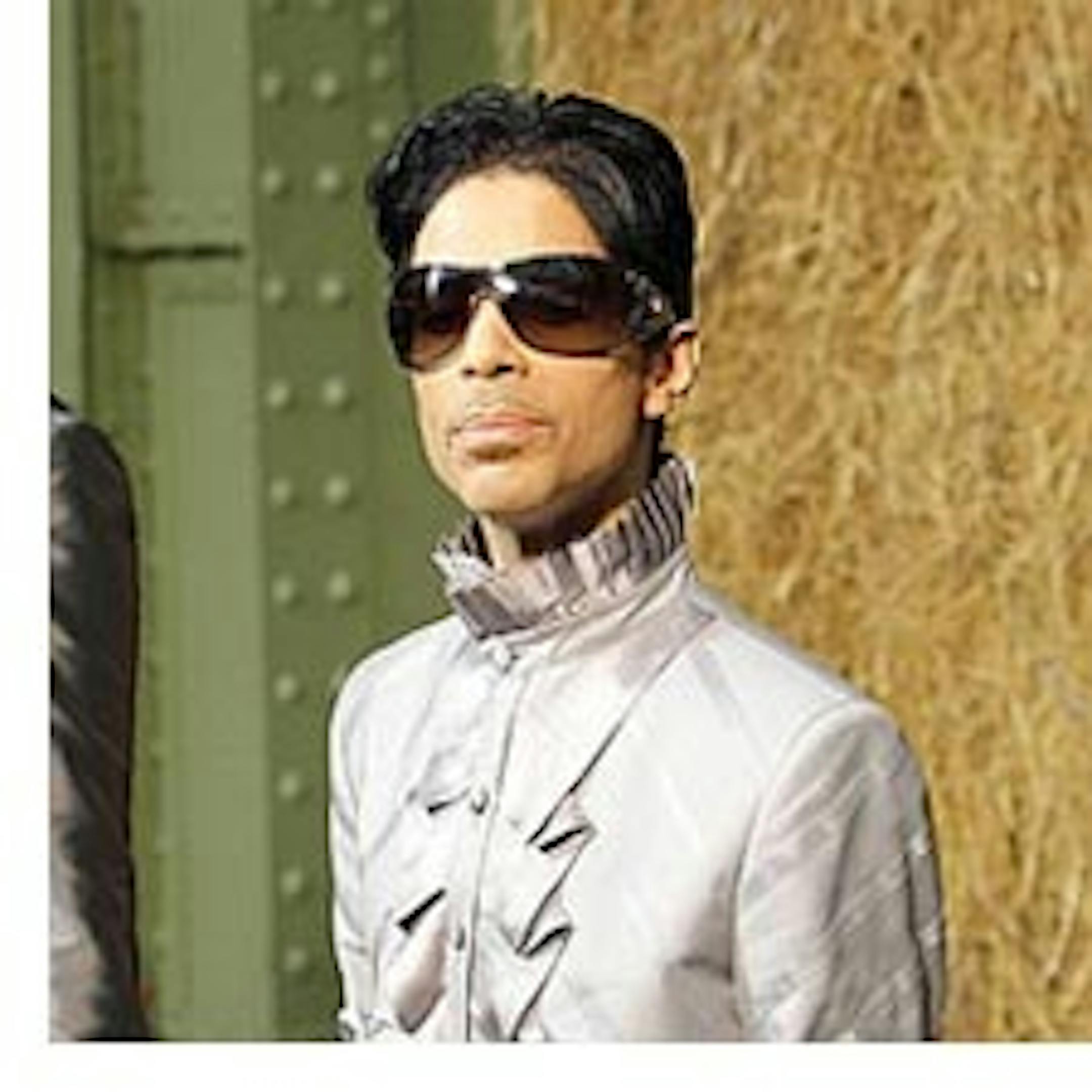 US singer Prince, seen, before the presentation of Chanel's spring summer 2010 ready-to-wear fashion collection by German fashion designer Karl Lagerfeld, Tuesday, Oct. 6, 2009, in Paris. (AP Photo/Christophe Ena)
