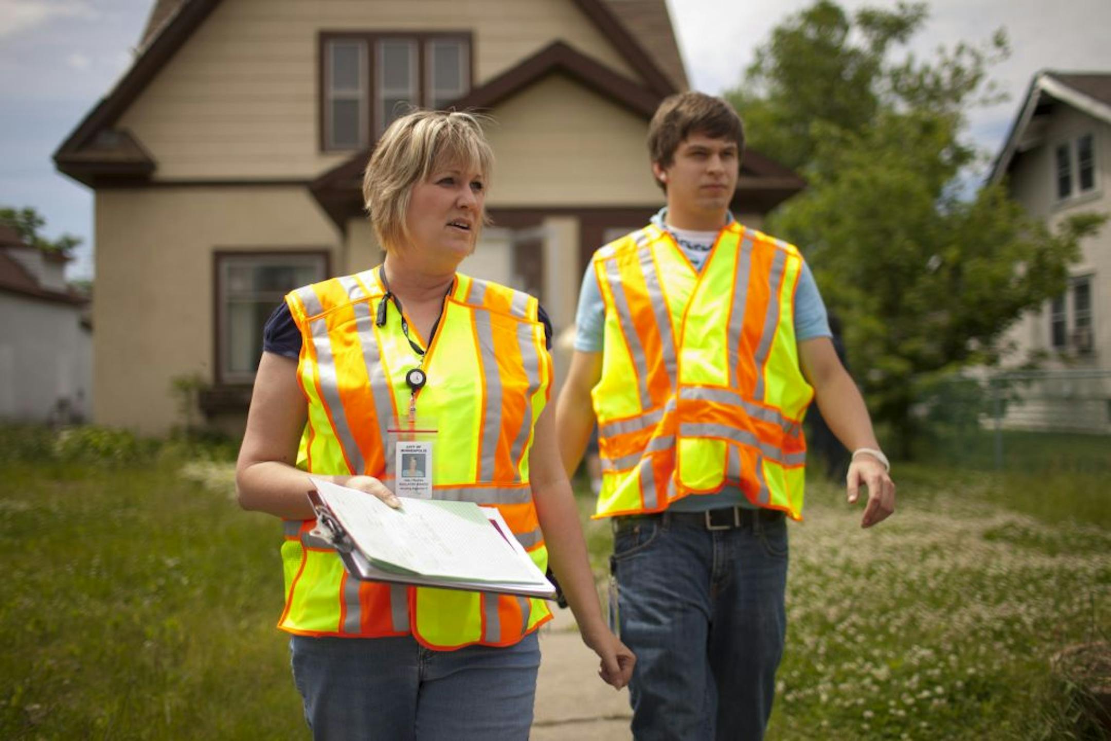 Minneapolis housing inspector Jody Waulters and intern Brett Anderson left a Bryant Avenue rental property Monday after confirming it was unoccupied.