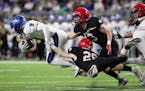 Eden Prairie defensive backs Grant Harstad (26) Aaron Timm (13) tried to stop Minnetonka's Jack Beil during the Class 6A Prep Bowl. (Anthony Souffle /