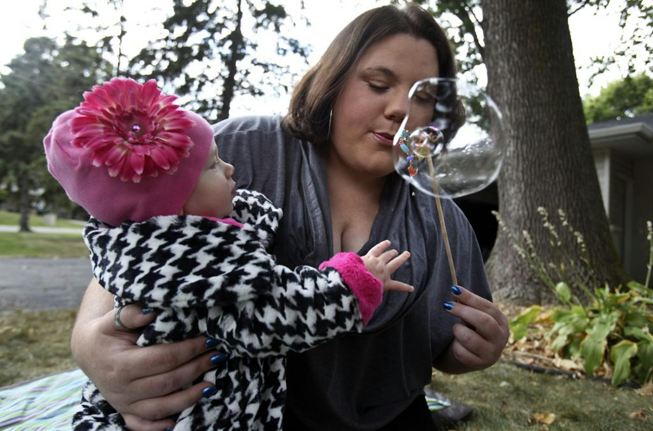 Swiss au pair Fabienne Buehler entertained 9-month-old Sophie Katz. "It's much cheaper" to have live-in child care, said Sophie's mom, Emily.