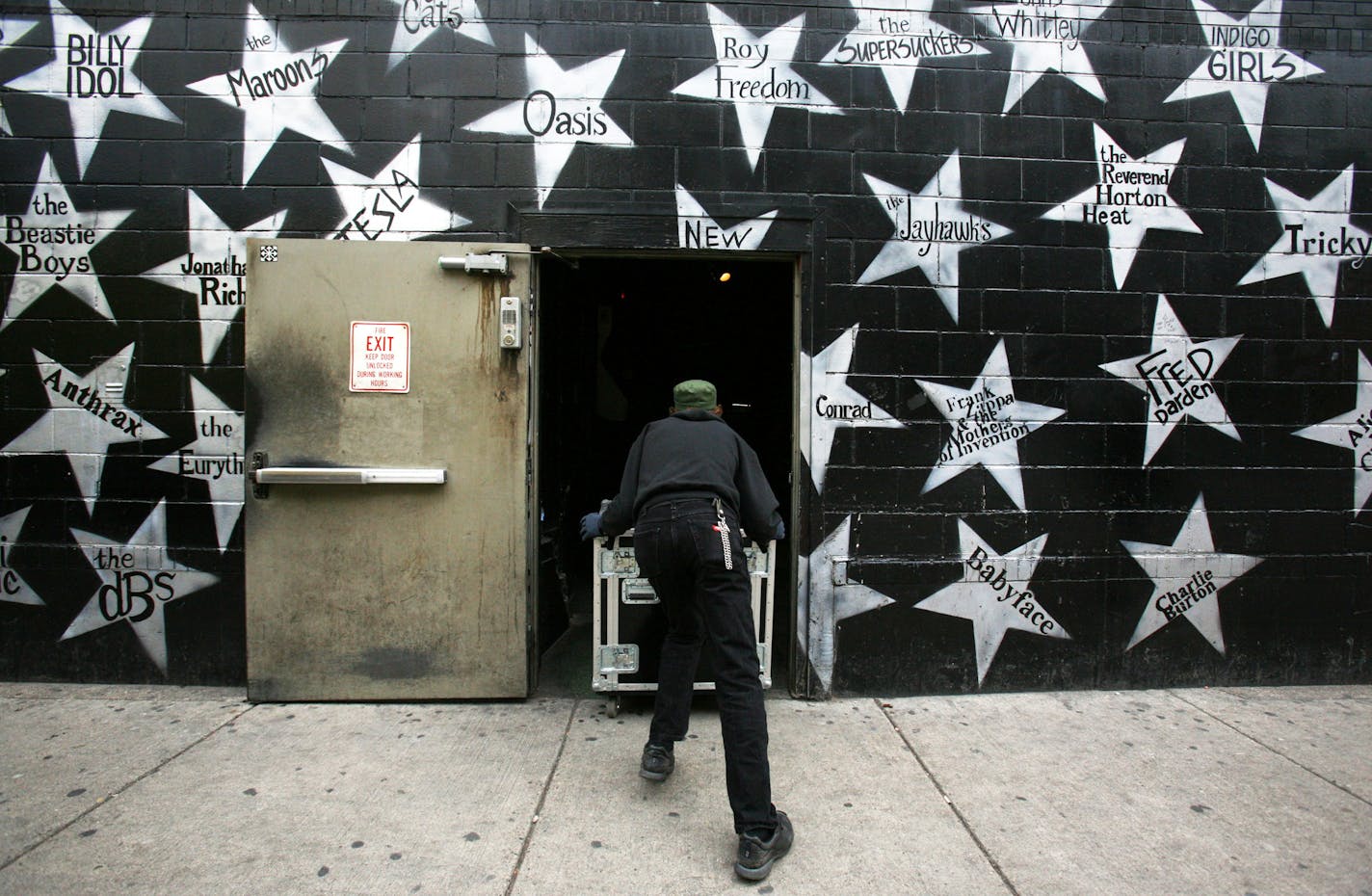 KYNDELL HARKNESS • kharkness@startribune.com] Conrad Sverkerson, stage manager, wheeled in equipment for m.i.a. passed his star on the wall of fame at First Ave.