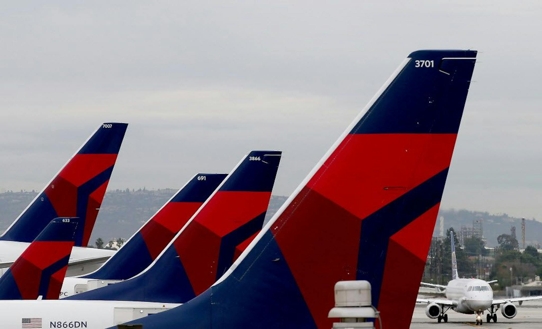 Delta Airlines aircraft are lined up at Terminal 5 in Los Angeles International Airport on Dec. 21, 2016. In December, Delta Air Lines will launch its first daily Los Angeles-to-Mexico City flights since 2005.