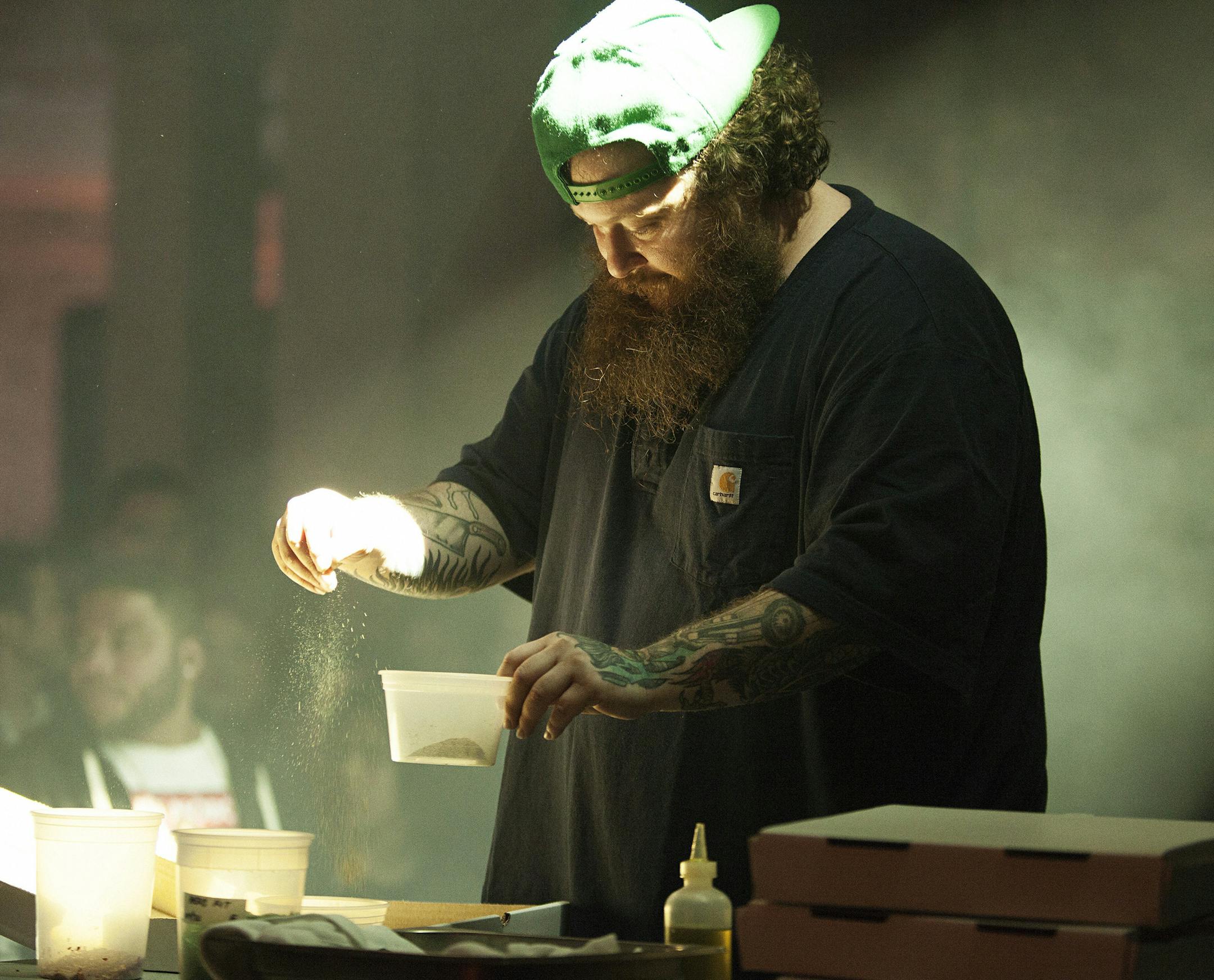 Action Bronson, rapper and a host of a Vice show, makes a pizza while performing at the NewFronts event in New York, May 1, 2015. Even as cash flows freely in Viceís direction, the company is trying to keep its brash, insurgent image. (Jesse Dittmar/The New York Times)