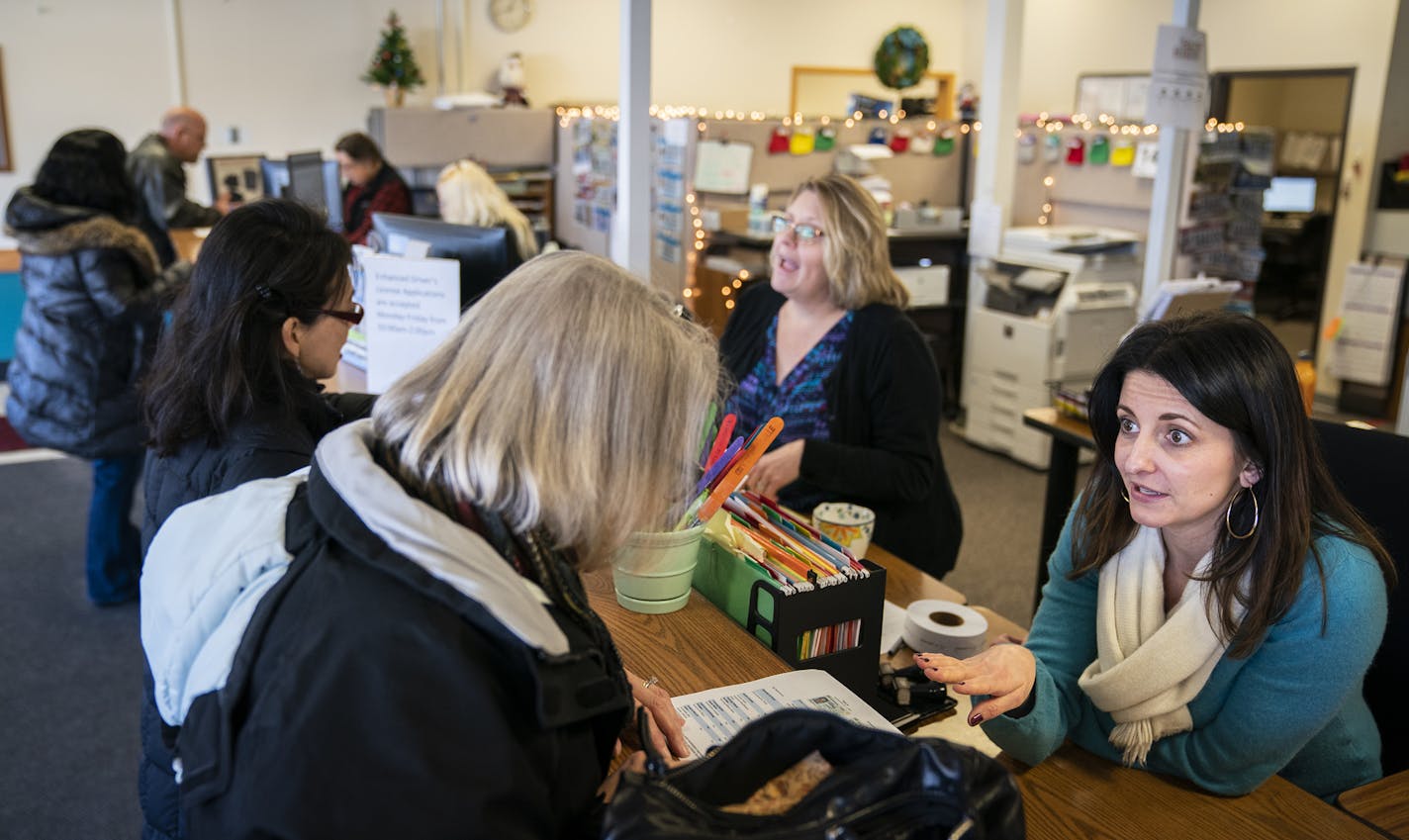 Motor vehicle supervisor Tereza Bazac helped a customer at the Roseville License Center. Problems with the Minnesota Licensing and Registration System prompted legislators to further examine Minnesota's information technology agency.