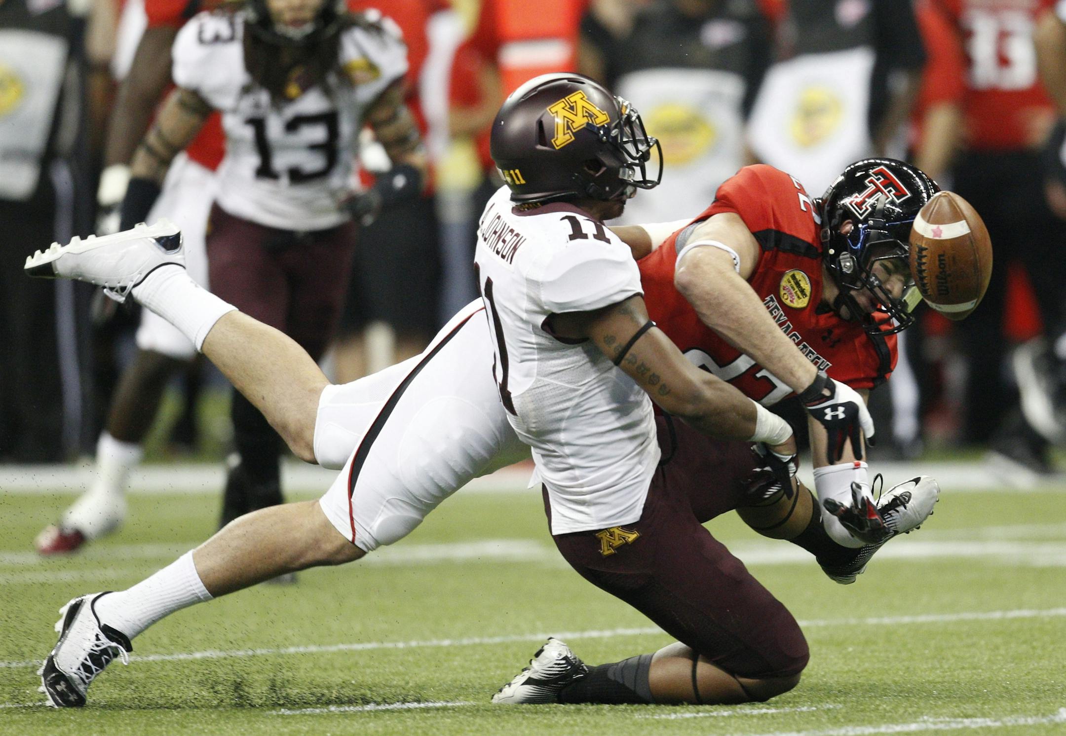 Minnesota's Antonio Johnson (22) breaks up a pass intended for Texas Tech's Jace Amaro during the second quarter of the Meineke Car Care Bowl of Texas on Friday, December 28, 2012, at Reliant Stadium in Houston, Texas.