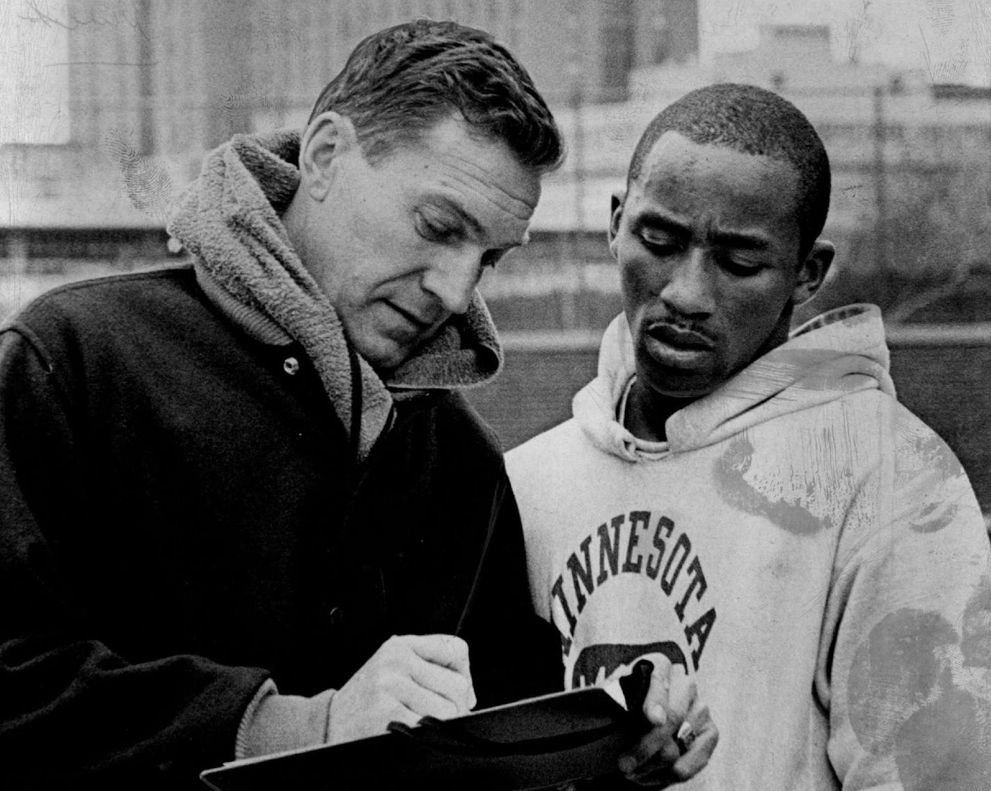 April 17, 1967 Checking The From Chart Coach Roy Griak (L), Hubie Bryant. April 18, 1967 Larry Schreiber, Minneapolis Star Tribune ORG XMIT: MIN2015070922402989