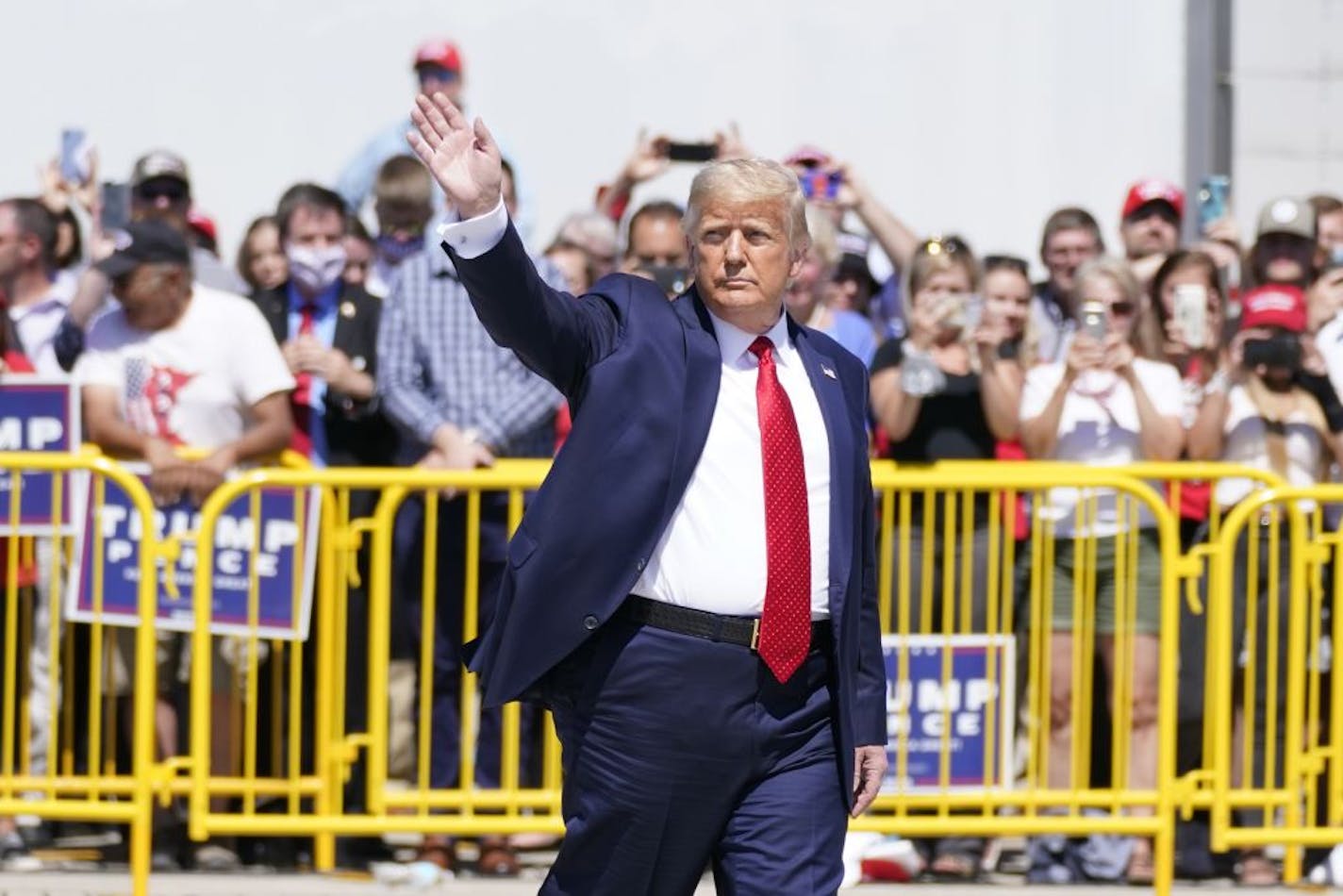 President Donald Trump wraps up speaking to a crowd of supporters at Minneapolis-Saint Paul International Airport, Monday, Aug. 17, 2020, in Minneapolis.