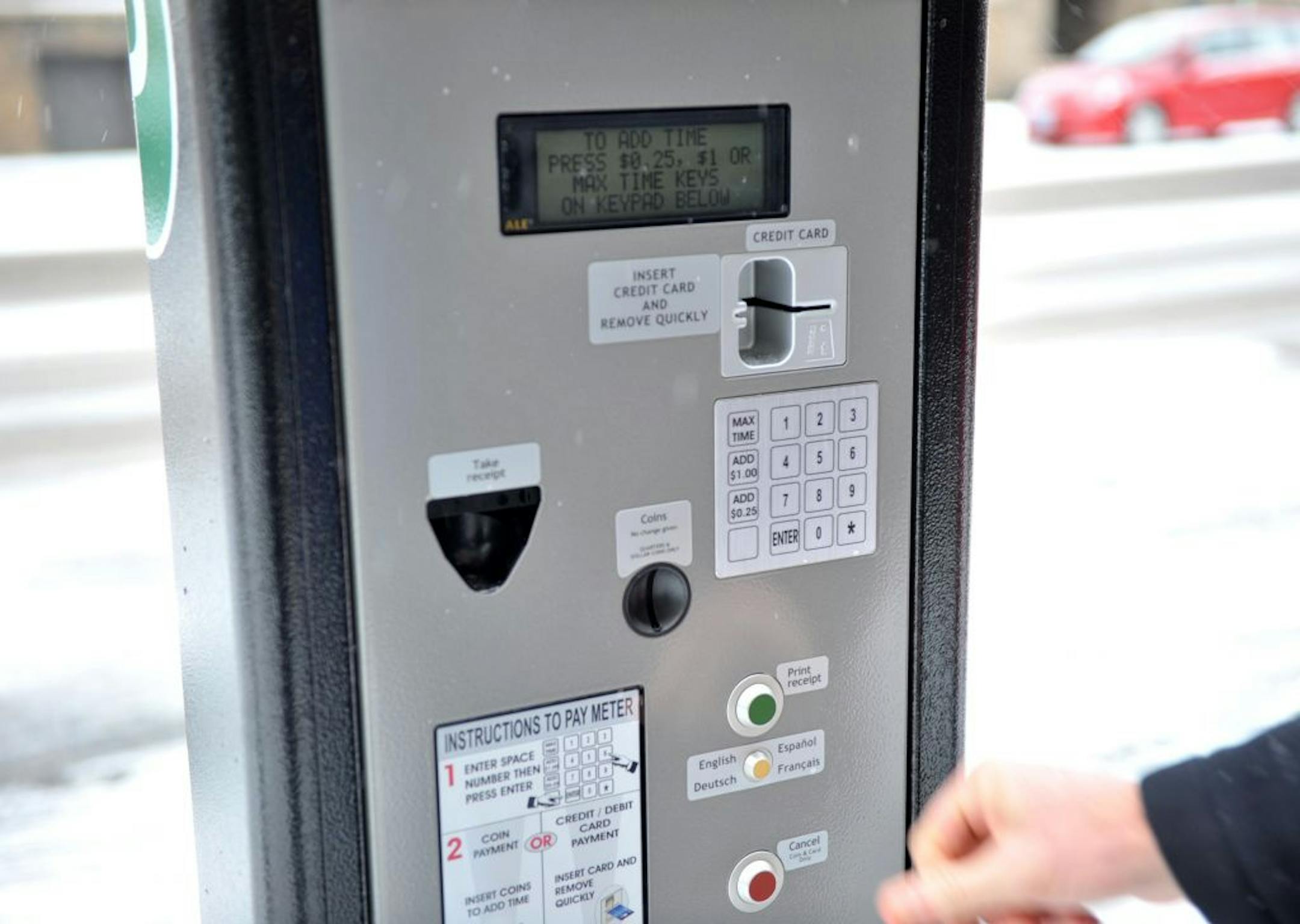 Mayor R. T. Rybak demonstrated one of Minneapolis' Wi-fi parking meters which takes credit and debit cards and uses Wi-fi to authenticate them.