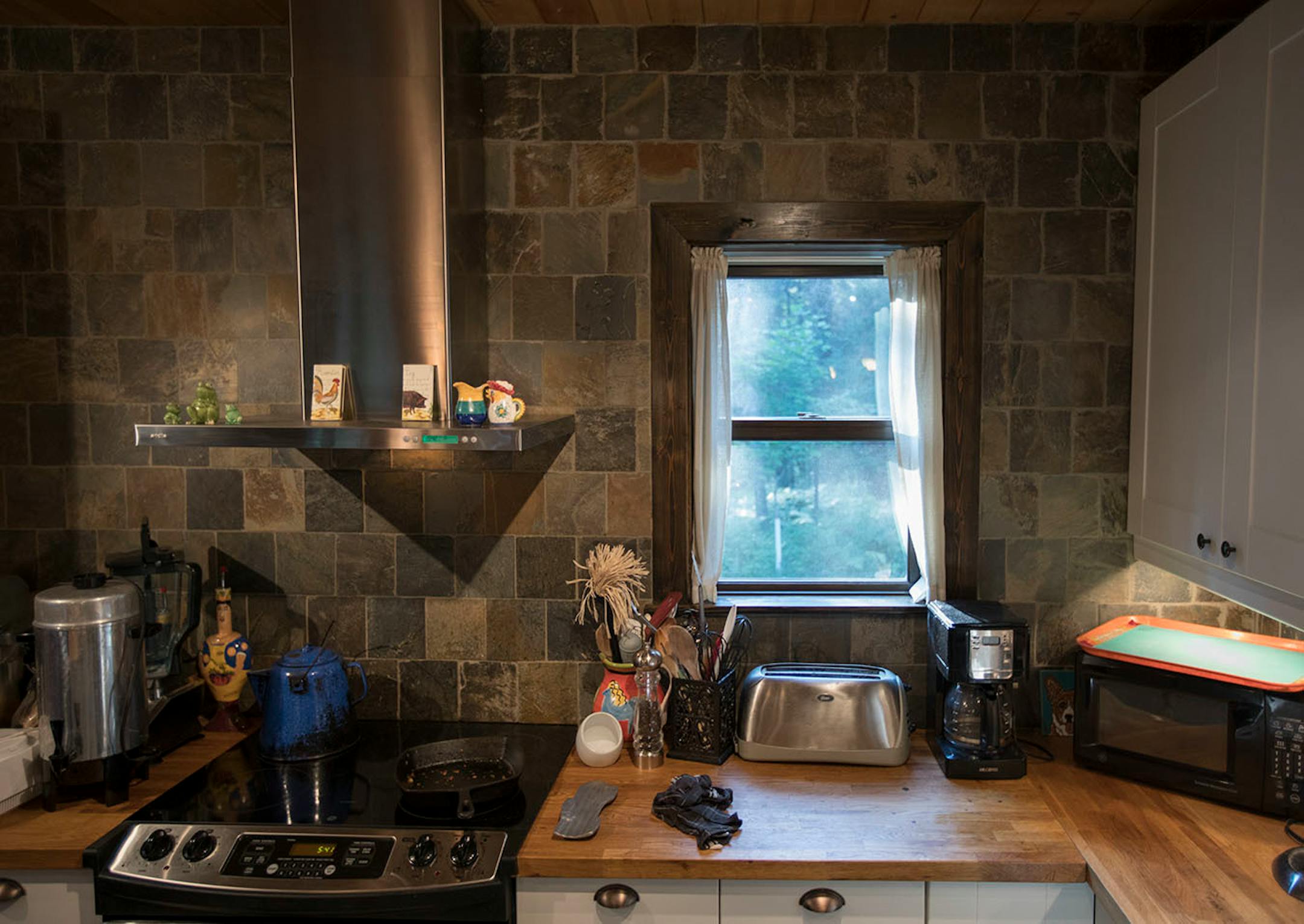The kitchen area is small but well planned for cooking.