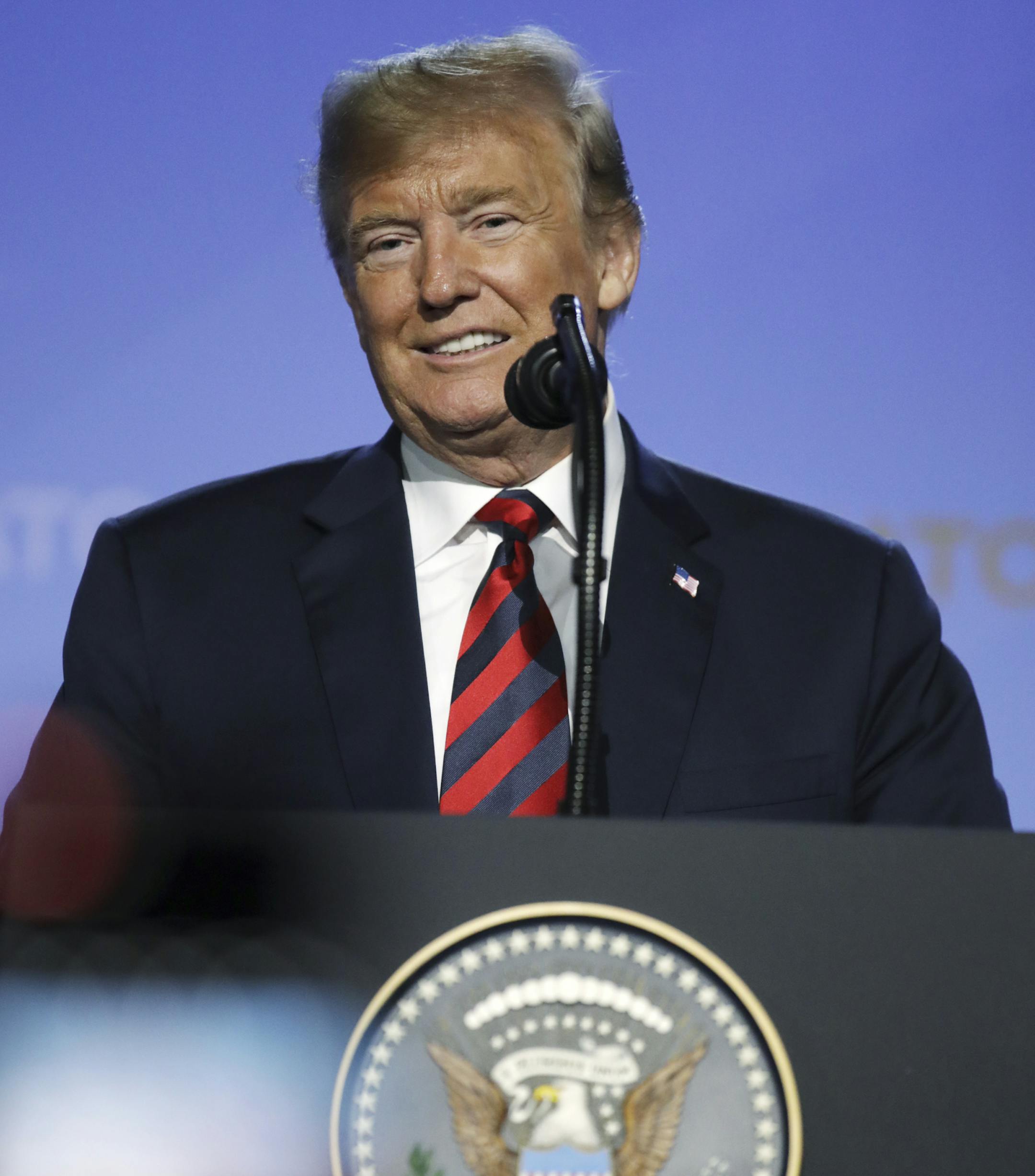 U.S. President Donald Trump smiles during a press conference after a summit of heads of state and government at NATO headquarters in Brussels, Belgium, Thursday, July 12, 2018. NATO leaders gather in Brussels for a two-day summit. (AP Photo/Olivier Matthys)