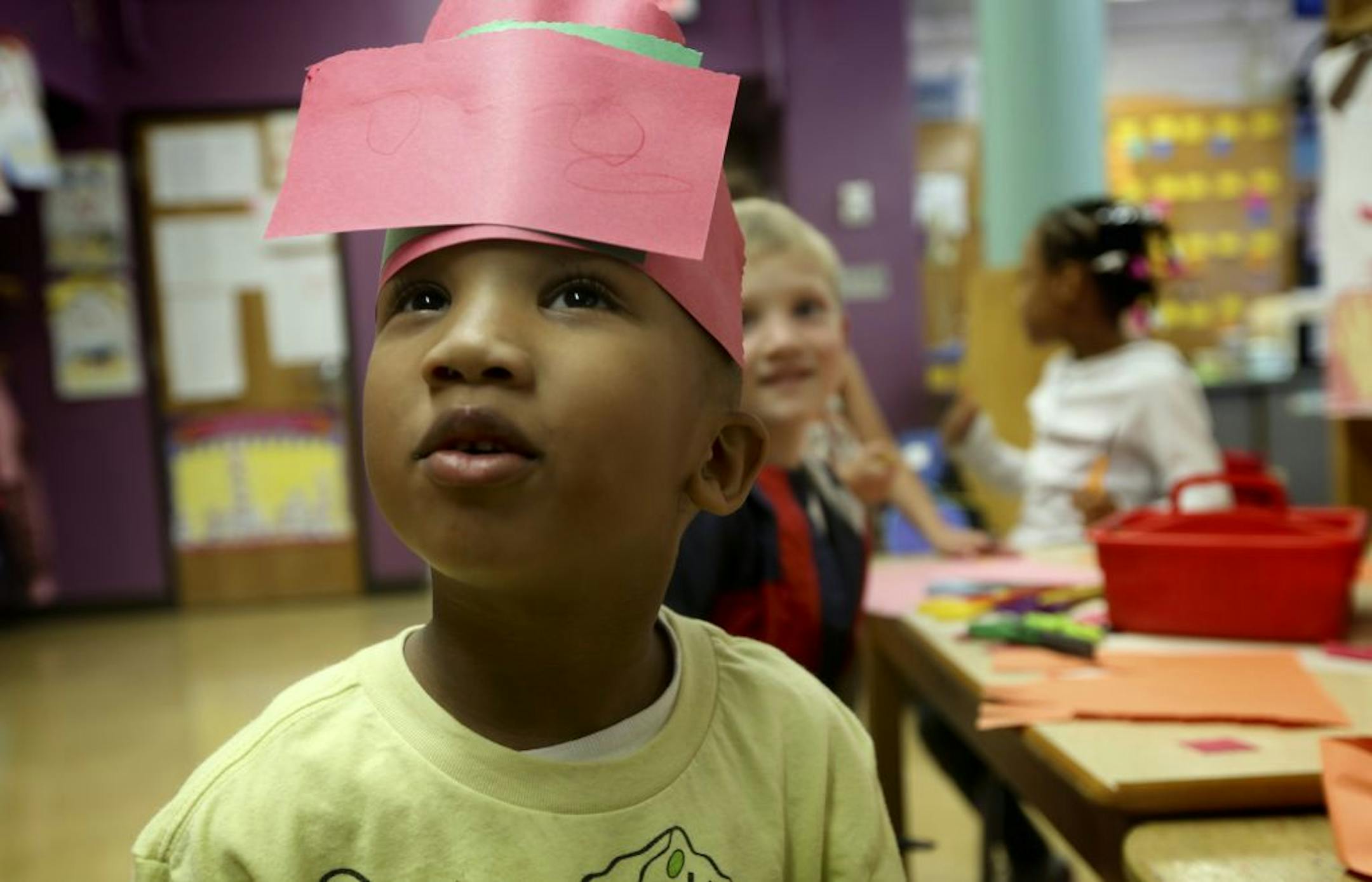 Legend Wright, a kindergarten student at Kenny Community School, showed off the hat he made at the art table Tuesday during class.