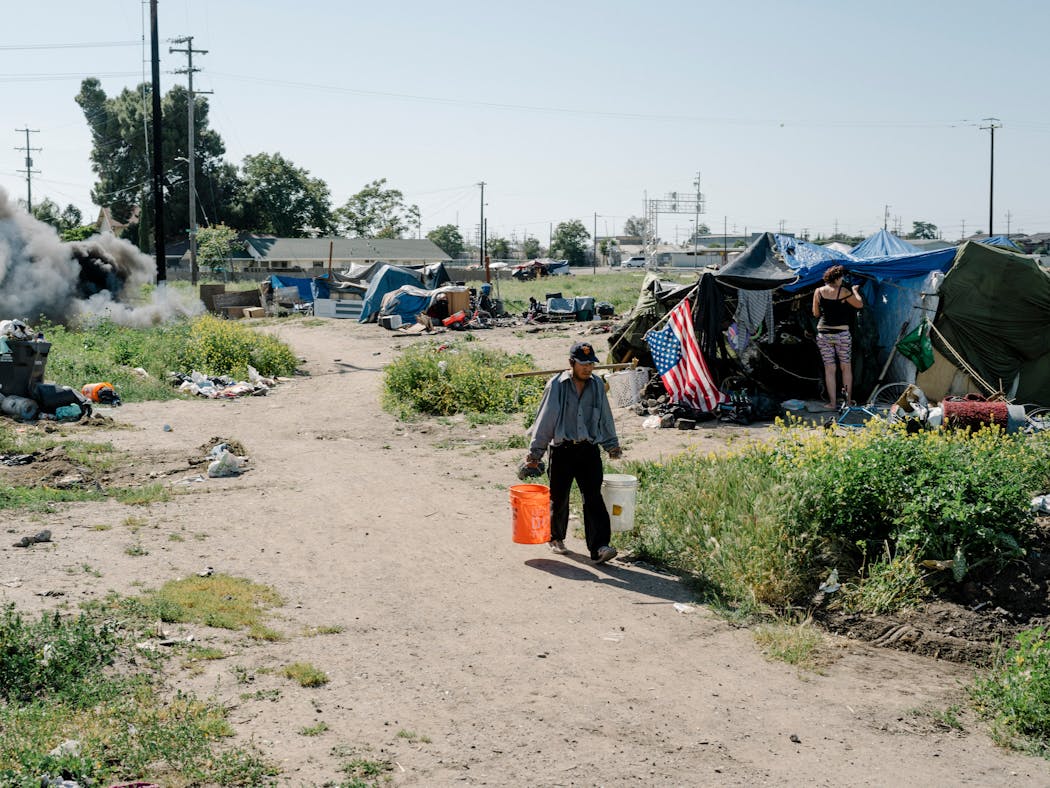 A  homeless encampment in Stockton, Calif., seen April 23, 2018. Long plagued by poverty and desperation, Stockton hoped to become an exhibition for the simple but unorthodox experiment of universal basic income: giving $500 a month in donated cash to perhaps 100 local families, no strings attached.