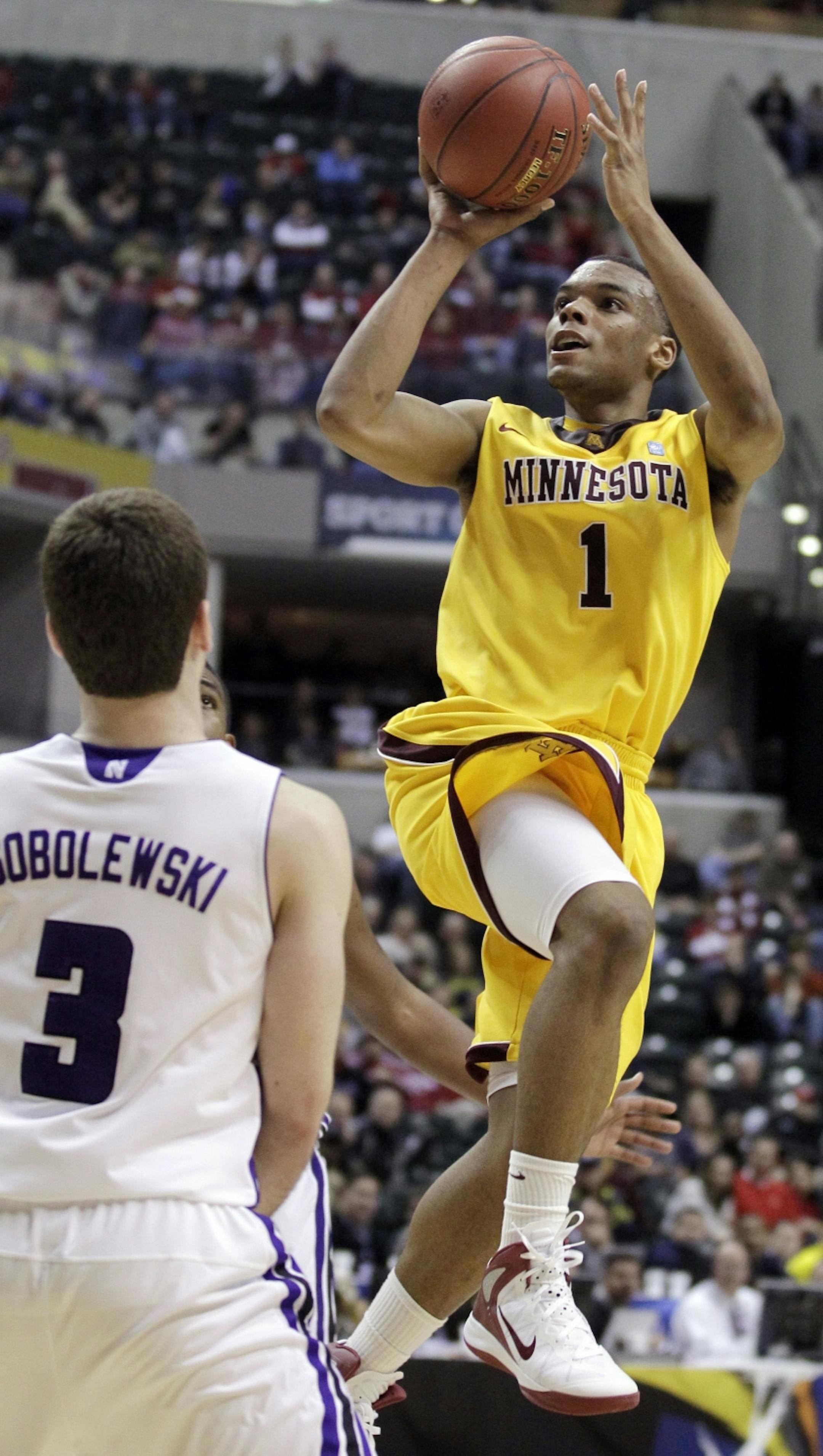 Minnesota guard Andre Hollins (1) goes up for a jump shot against Northwestern guard Dave Sobolewski in the overtime of an NCAA college basketball game at the first round of the Big Ten Conference tournament in Indianapolis, Thursday, March 8, 2012. Minnesota won 75-68 in overtime.