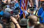 The Minnesota National Guard color guard posted the colors. ] GLEN STUBBE * gstubbe@startribune.com Monday, May 30, 2016 Memorial Day ceremony at Lake