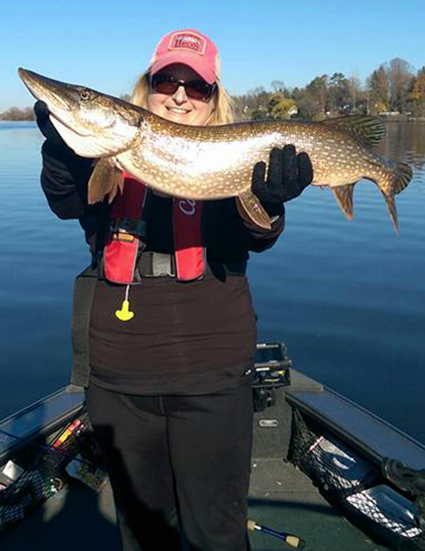 A member of Women Anglers of Minnesota, Elizabeth Colsen of Bloomington hoists a trophy-size northern pike. ORG XMIT: Bh4Y5Z5zATixB2730qlc