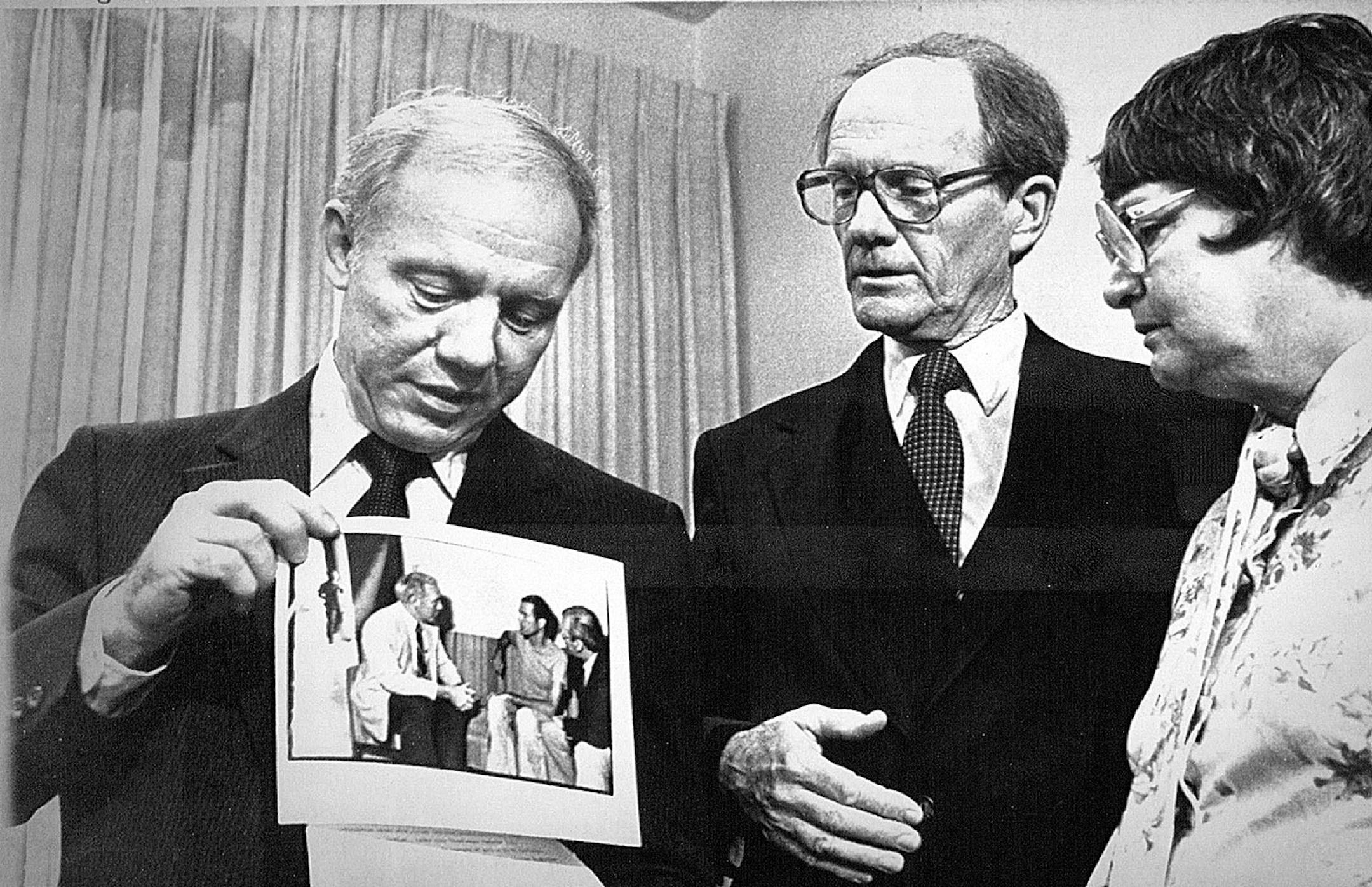 March 31, 1983 Jail Picture-U. S. Rep. James Oberstar, D-Minn., displays a photo taken of himself and jailed free-lance journalist T.J Western in an El Salvador jail Wednesday to Western's parents, Robert and Laraine Western of St. Paul, during a Thursday news conference. Oberstar aided in arranging the release later Wednesday of Western and another journalist. Jim Mone, AP Laserphoto