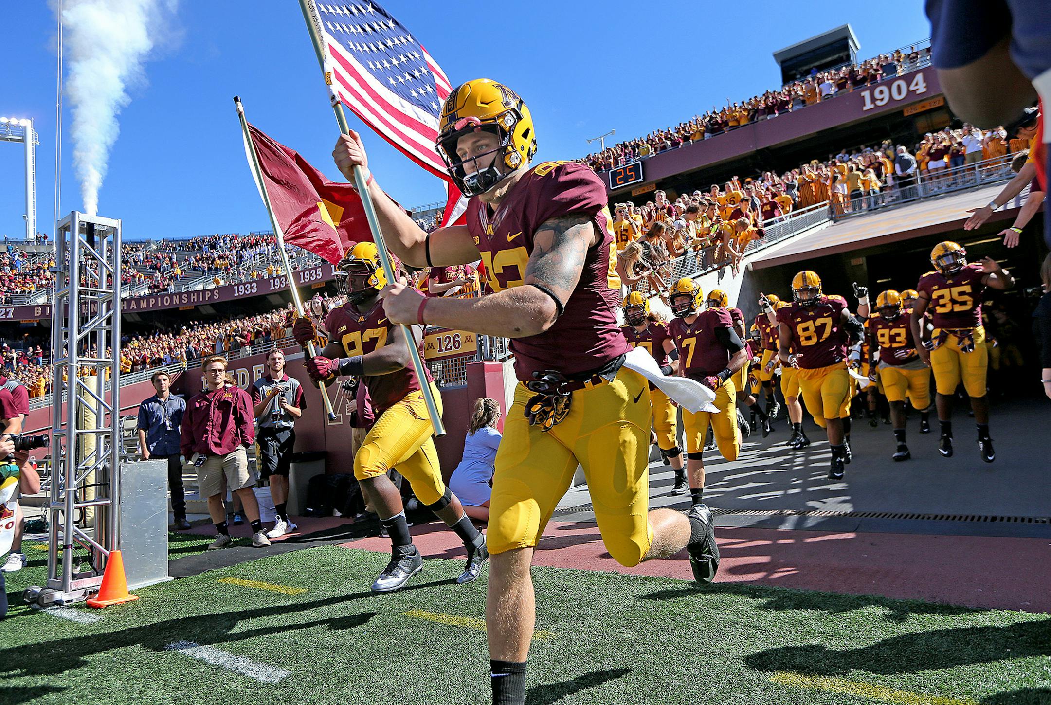 Minnesota Gophers wide receiver Drew Wolitarsky carried the American Flag and led the team onto the field before the Gophers took on Indiana State at TCF Bank Stadium, Saturday, September 10, 2016 in Minneapolis, MN. ] (ELIZABETH FLORES/STAR TRIBUNE) ELIZABETH FLORES &#x2022; eflores@startribune.com