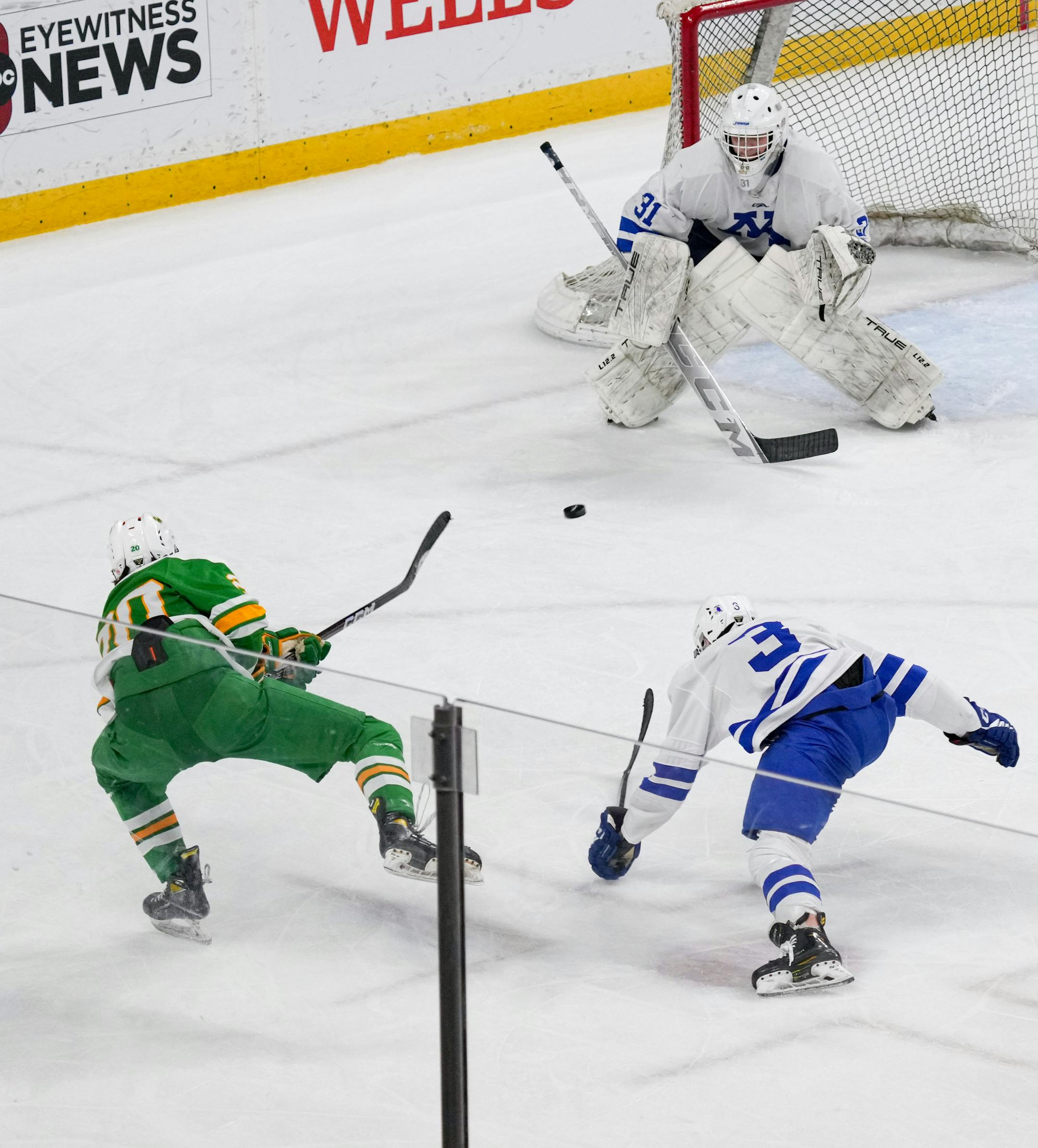 Edina forward John Halverson (10) tries unsuccessfully to score a goal on Minnetonka in the second period.