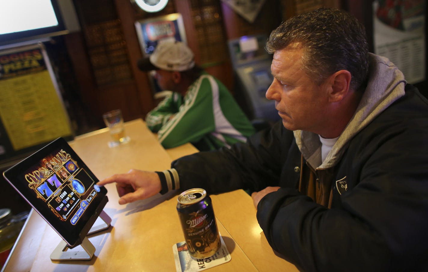 Randy Langenenks played an electronic pull tab game at Porky's Bar in St. Paul, Min., Thursday, May 9, 2013. This small bar consistently ranks in the top 10 in the sale of electronic pull tabs in Minnesota ] (KYNDELL HARKNESS/STAR TRIBUNE) kyndell.harkness@startribune.com