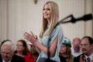 Ivanka Trump, the daughter of President Donald Trump, applauds during a signing ceremony where President Donald Trump signed an Executive Order that e