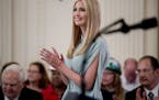 Ivanka Trump, the daughter of President Donald Trump, applauds during a signing ceremony where President Donald Trump signed an Executive Order that e