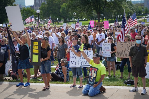A large crowd filled the Minnesota State Capitol Lawn during a rally for medical freedom on Saturday, August 28, 2021. The crowd opposed medical and g