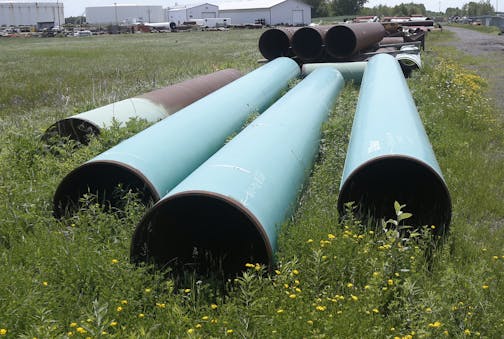 Stored pipeline at Enbridge's Superior, Wis., terminal from the end of 2019. The company's proposal to build a pipeline across northern Minnesota is still on hold. (AP Photo/Jim Mone, File)