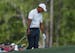 Tiger Woods reacts after hitting in the water on the 12th hole during the second round at the Masters golf tournament Friday, April 6, 2018, in August
