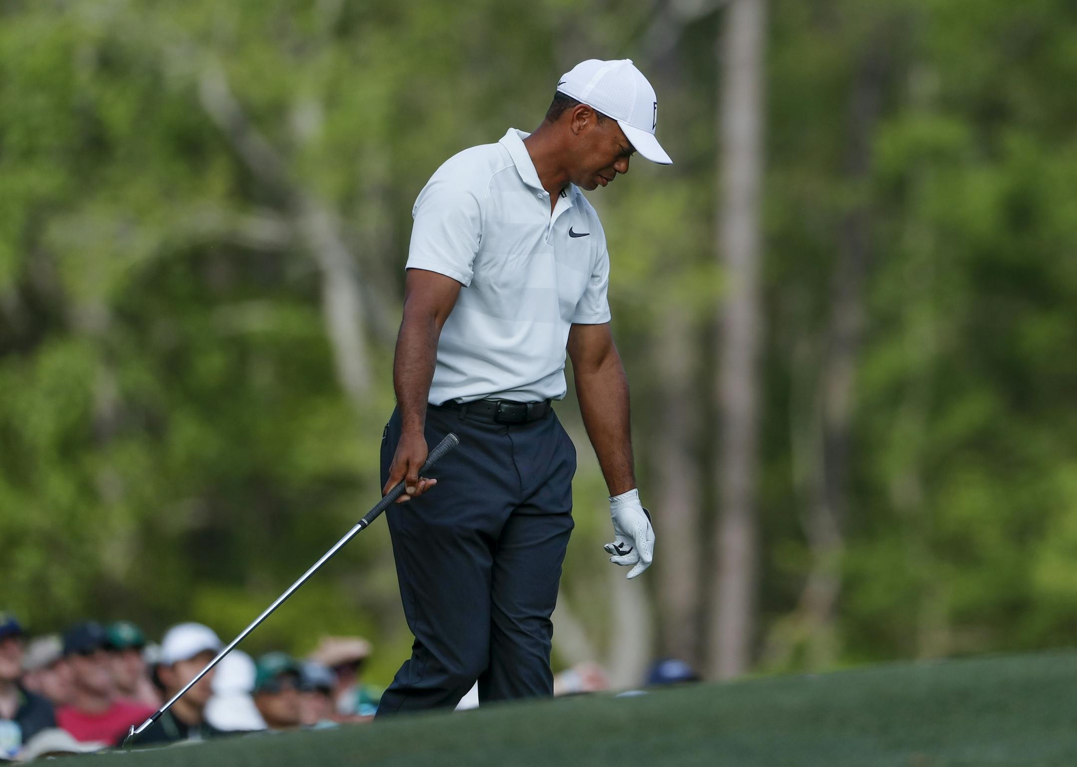 Tiger Woods reacts after hitting in the water on the 12th hole during the second round at the Masters golf tournament Friday, April 6, 2018, in Augusta, Ga. (AP Photo/David Goldman)
