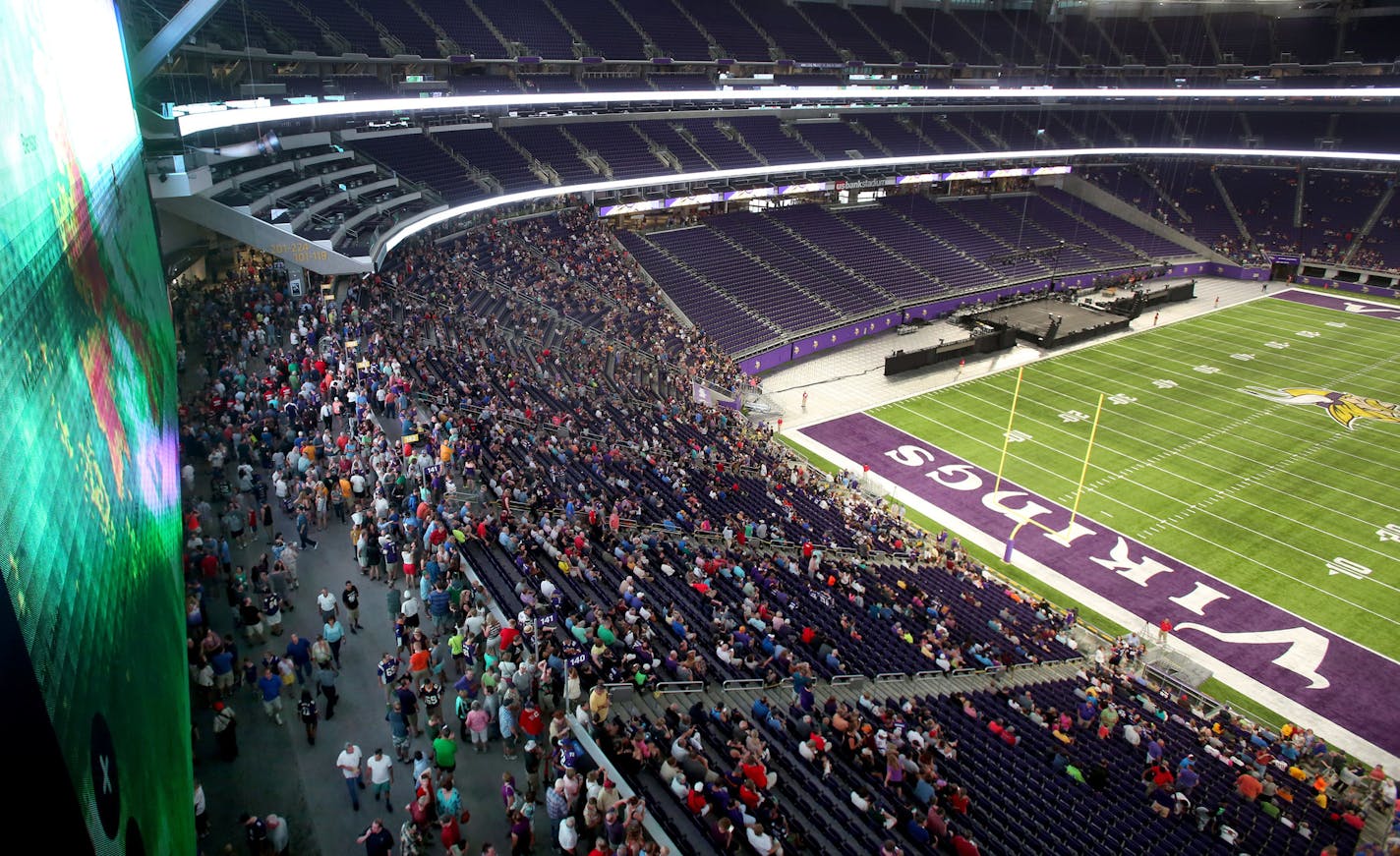 A large crowd was on hand for the public opening at the U.S. Bank Stadium as the current radar of a fast moving storm was visible Saturday, July 23, 2016, in Minneapolis, MN.](DAVID JOLES/STARTRIBUNE)djoles@startribune Thousands of people expected at U.S. Bank Stadium open house. We see what they think. It runs 9-5, but we'll aim to go in late morning.