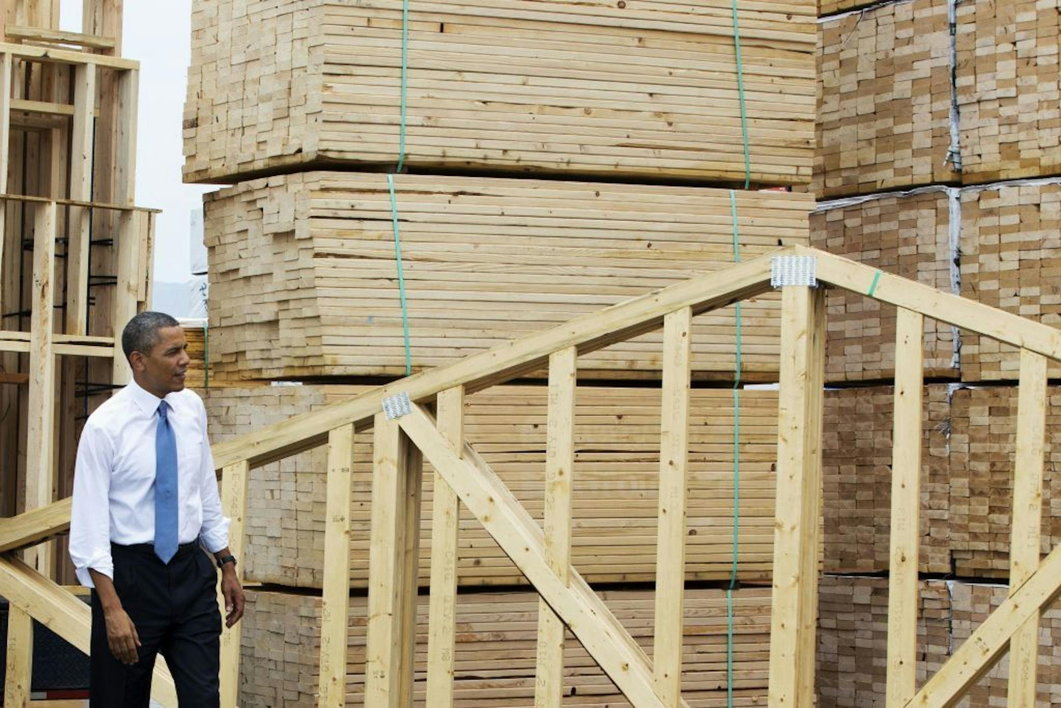 President Barack Obama tours the home framing assembly area at Erickson Construction in Chandler, Ariz., Tuesday, Aug. 6, 2013. The president will speak about housing before heading to Los Angeles where he will tape the �The Tonight Show with Jay Leno.�