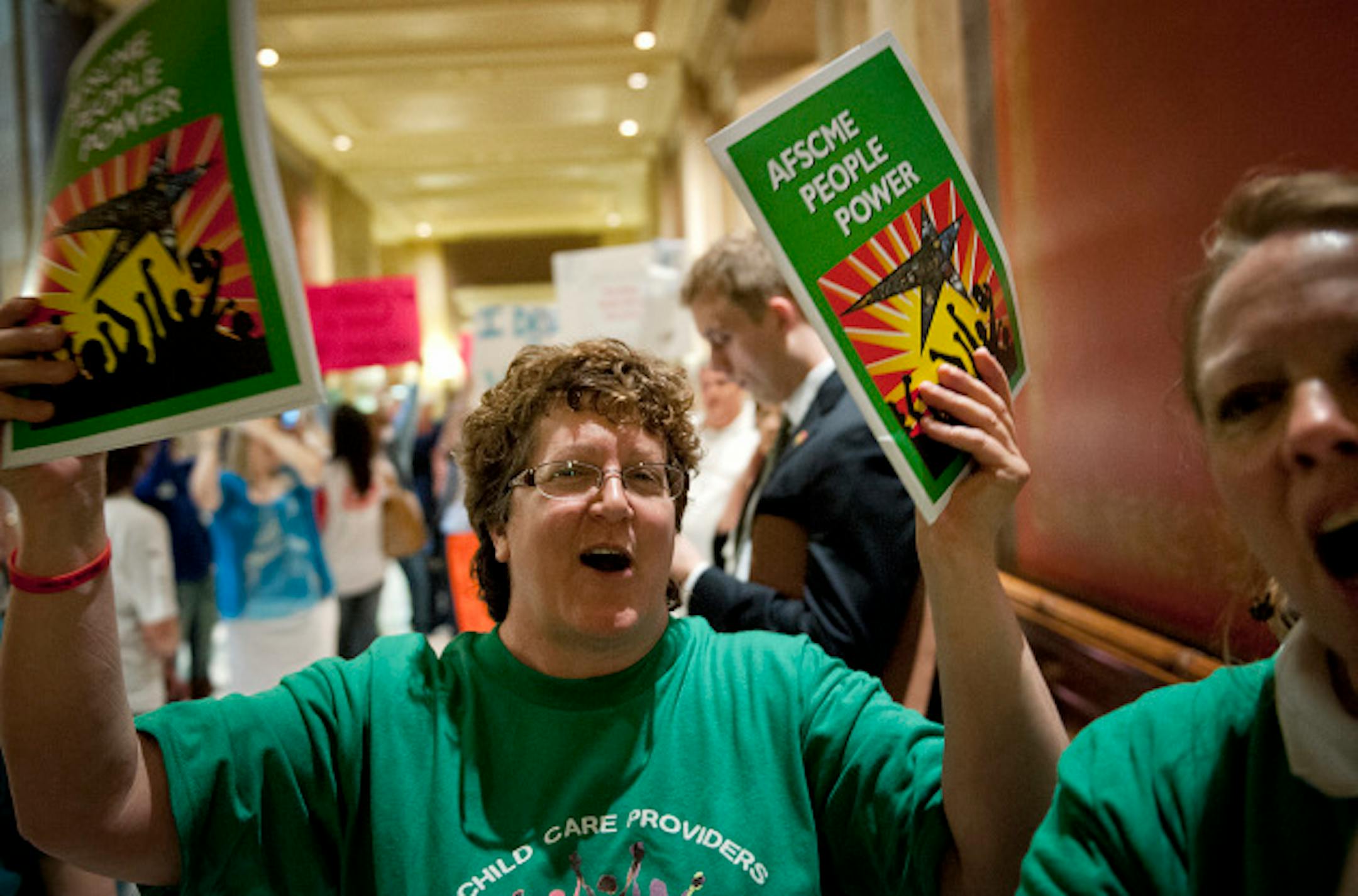 AFSCME Vote Yes advocate chanted outside the House Chamber.  Vote Yes and Vote No echoed in throughout the Capitol Saturday, May 18, 2013  as legislators were set to debate the childcare unionization bill.     ]   GLEN STUBBE * gstubbe@startribune.com