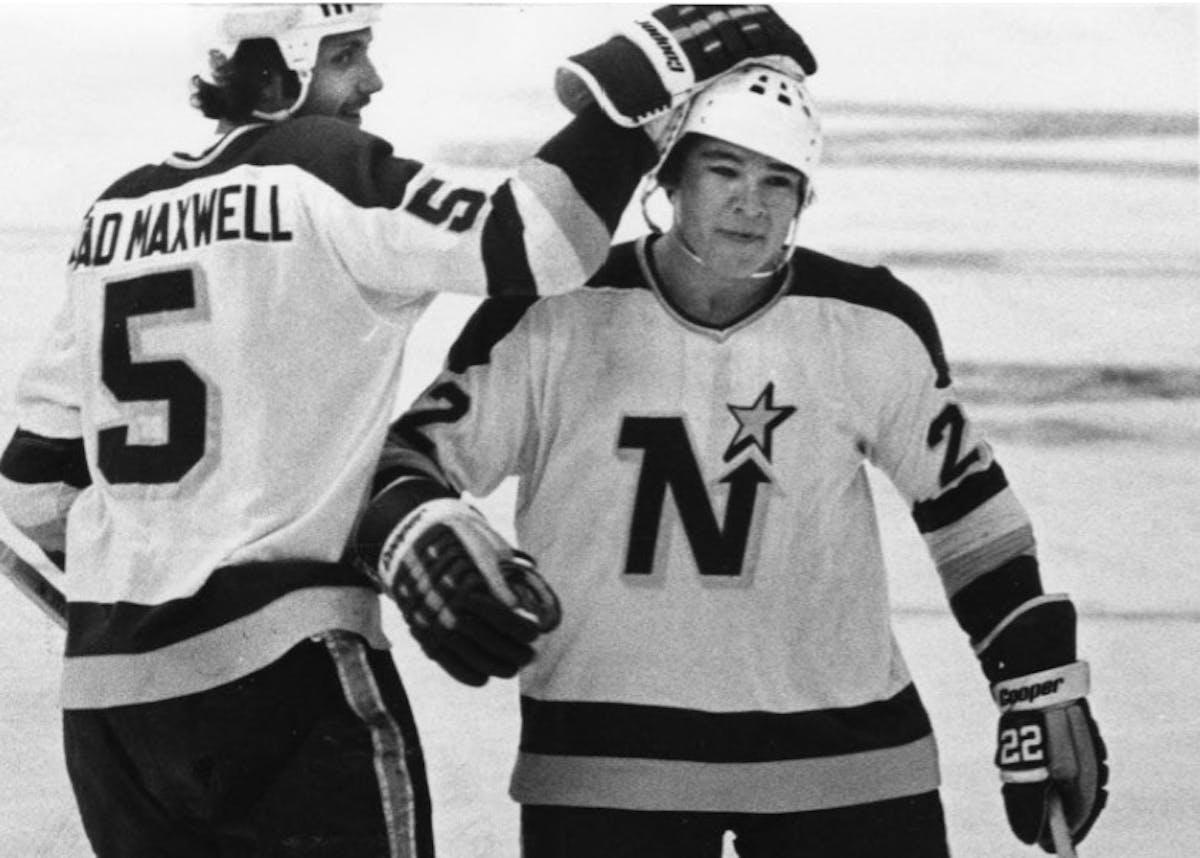 Brad Maxwell congratulated defense partner Gary Sargent after a North Stars goal during a game in 1978.