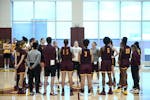 The Gophers huddled up around head coach Lindsay Whalen, center, at the conclusion of practice Wednesday.