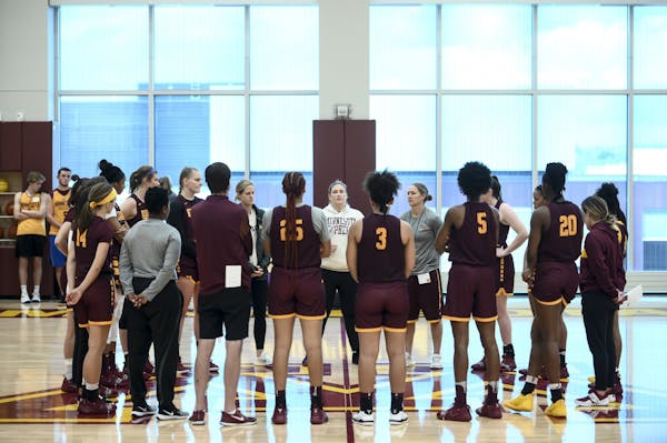 The Gophers huddled up around head coach Lindsay Whalen, center, at the conclusion of practice Wednesday.