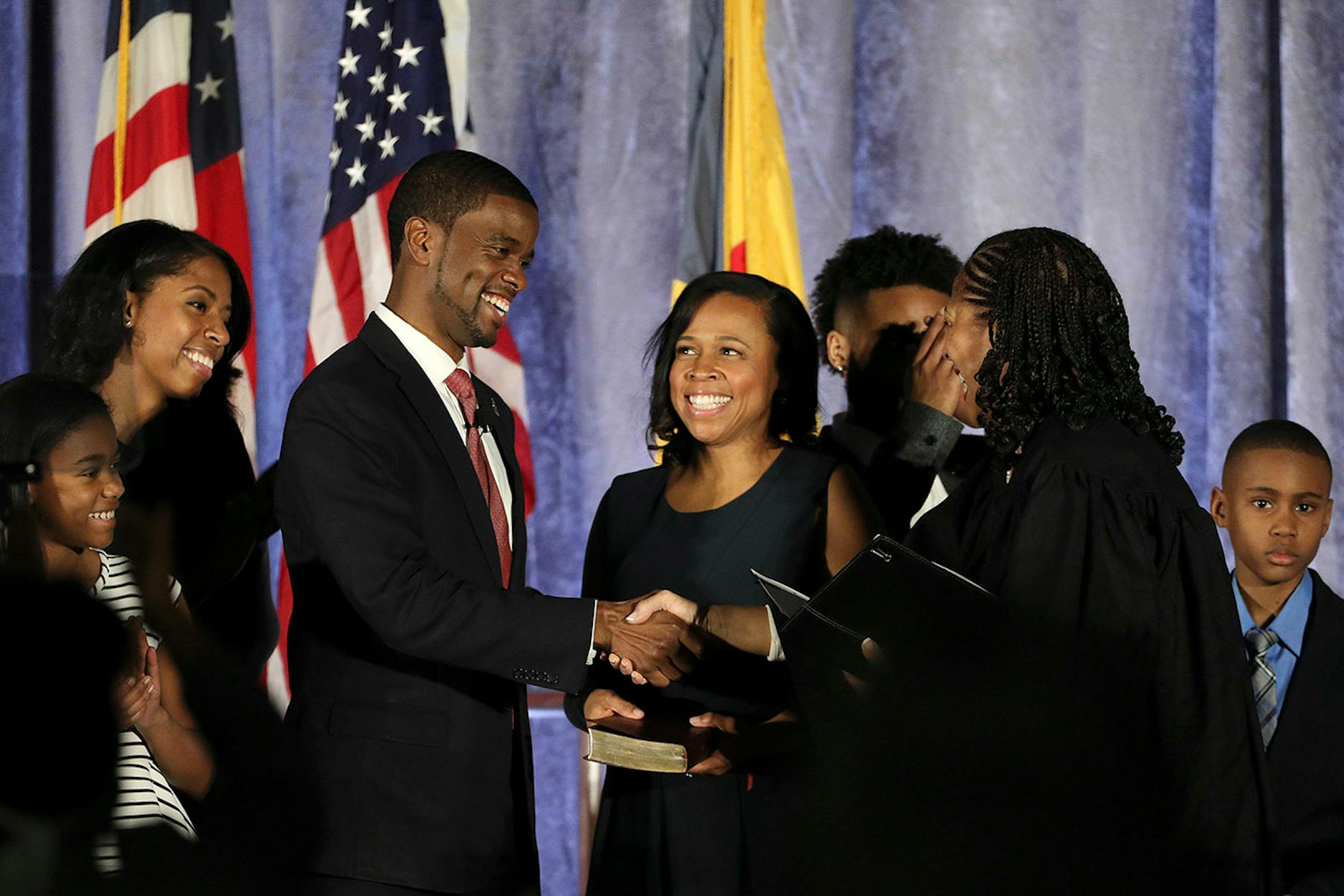 Melvin Carter and his wife Sakeena Carter were joined on stage by their family as Justice Tanya Bransford with the Fourth Judicial District administered the oath of office during Carter's swearing in ceremony as St. Paul mayor.