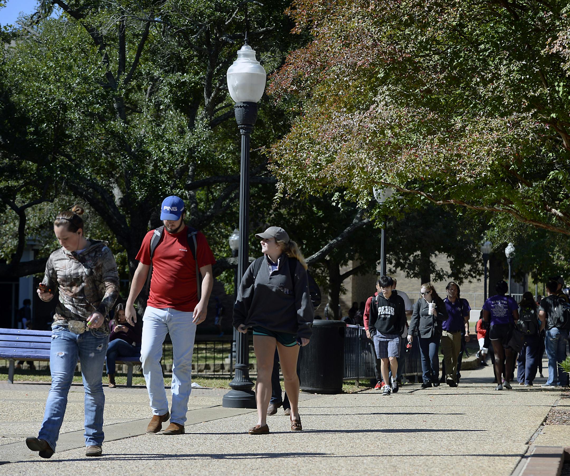 Students make their way around campus, at Stephen F. Austin State University Thursday, Oct. 30, 2014, in Nacogdoches, Texas. (AP Photo/The Daily Sentinel, Andrew D. Brosig) MANDATORY CREDIT