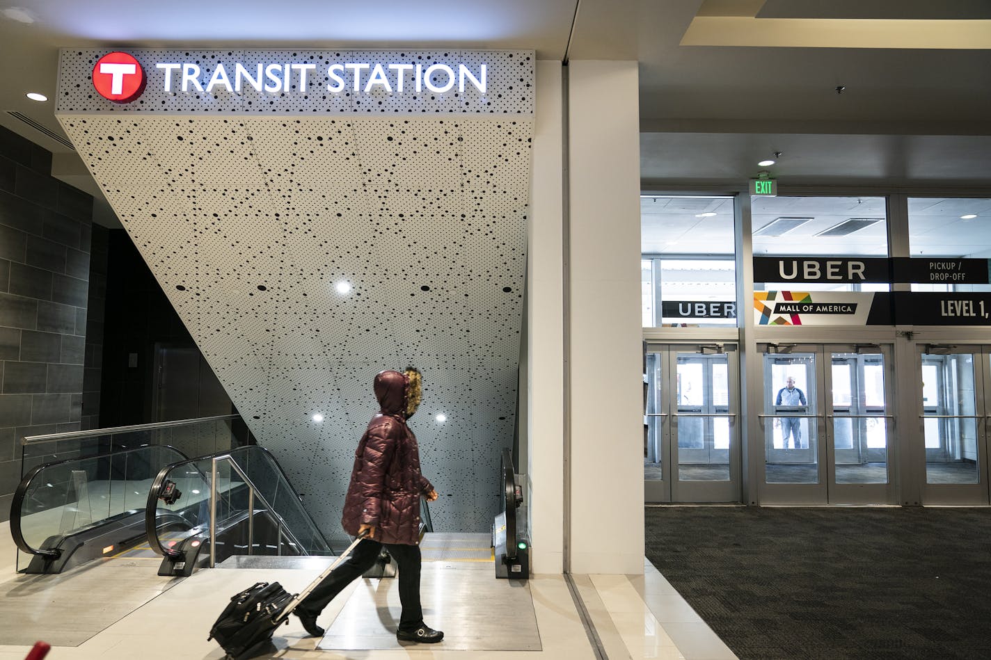 Commuters accessed the new Mall of America transit station from Mall of America via an escalator on Monday, Oct. 14. The station serves as a terminus for Blue Line light rail trains and the Red Line bus-rapid transit line, as well as several bus routes.