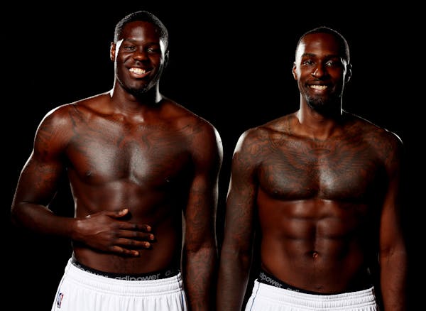Anthony Bennett, left, and Shabazz Muhammad pose for photos during Timberwolves media day at the Target Center on Monday, September 29, 2014. ] LEILA 