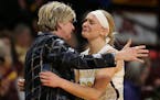 Minnesota coach Marlene Sotllings hugs senior guard Carlie Wagner during Tuesday night's final regular-season home game at Williams Arena.