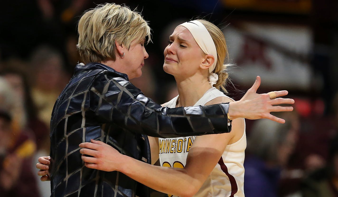 Minnesota coach Marlene Sotllings hugs senior guard Carlie Wagner during Tuesday night's final regular-season home game at Williams Arena.