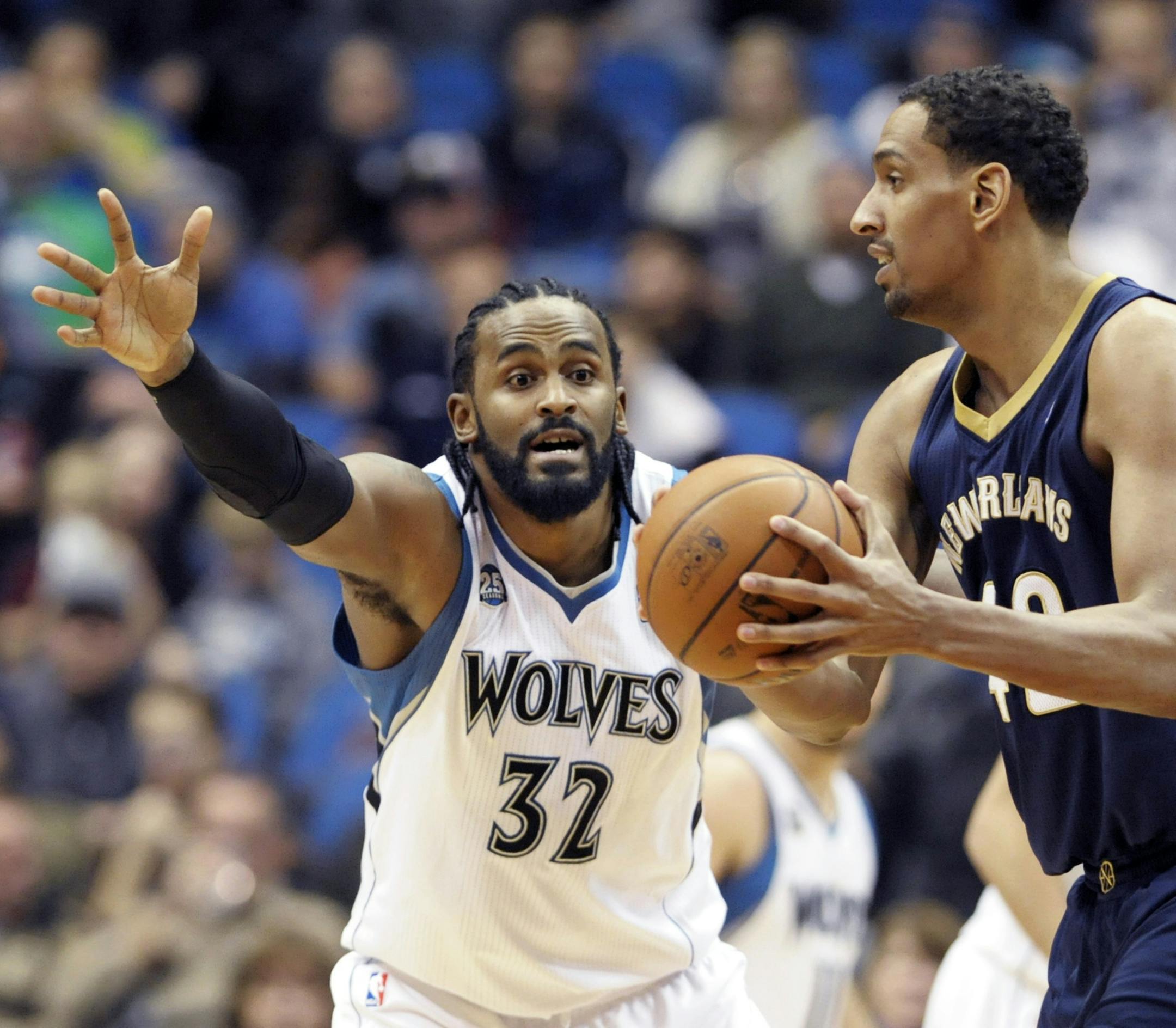 Wolves center Ronny Turiaf, left