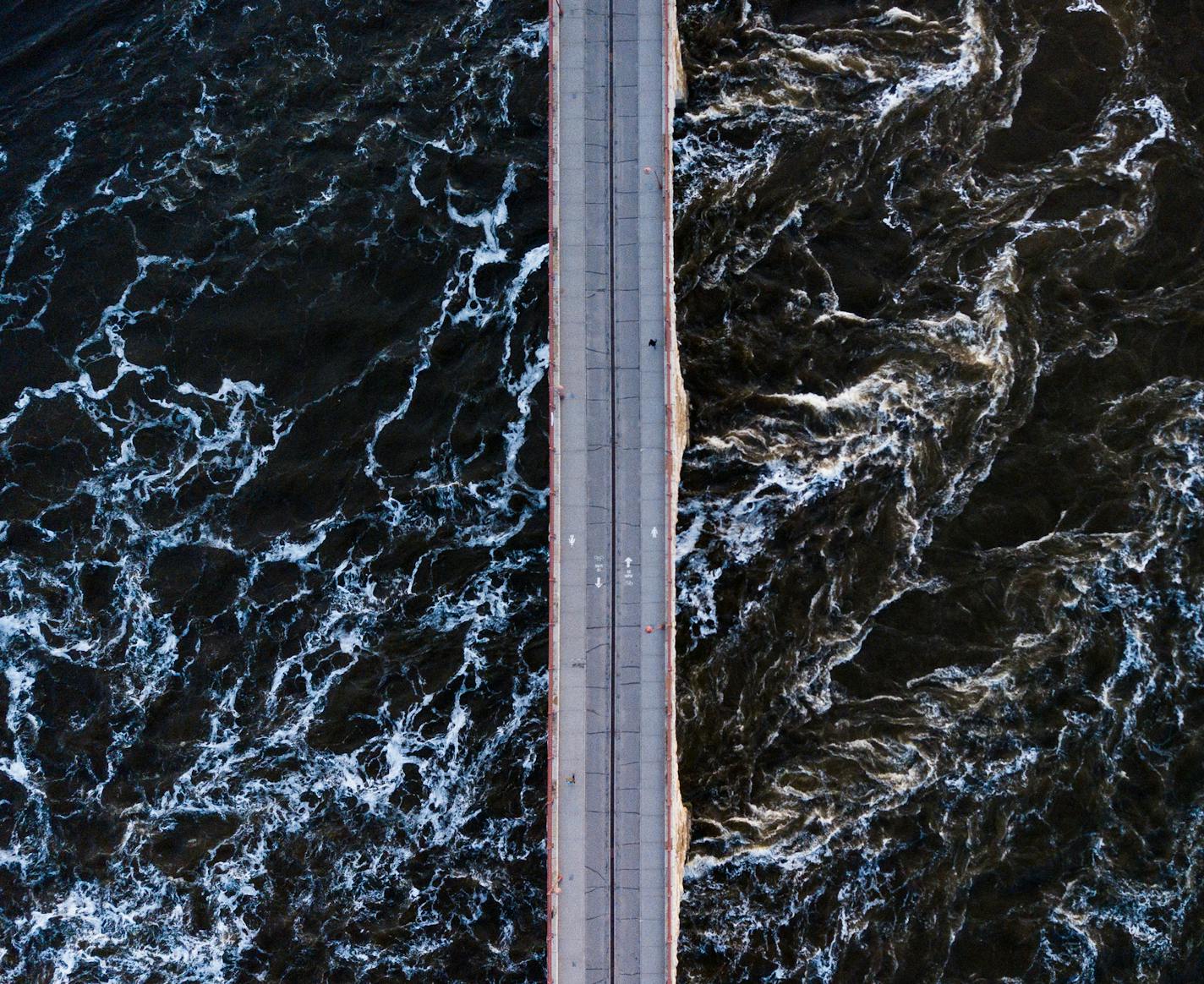 The Stone Arch Bridge over the Mississippi River was dotted with morning runners.