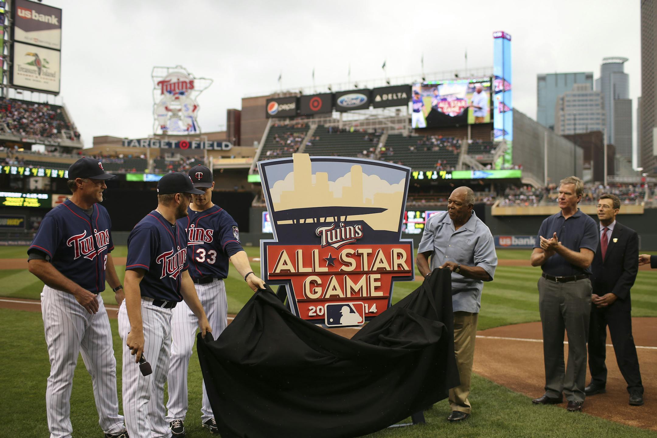 The logo for the 2014 All-Star game was unvieled to the public before Tuesday night’s game against the RoyalS. Past Twins All-Stars Tom Brunansky, Glen Perkins, Justin Morneau, and Tony Oliva, from left, uncovered the artwork.
