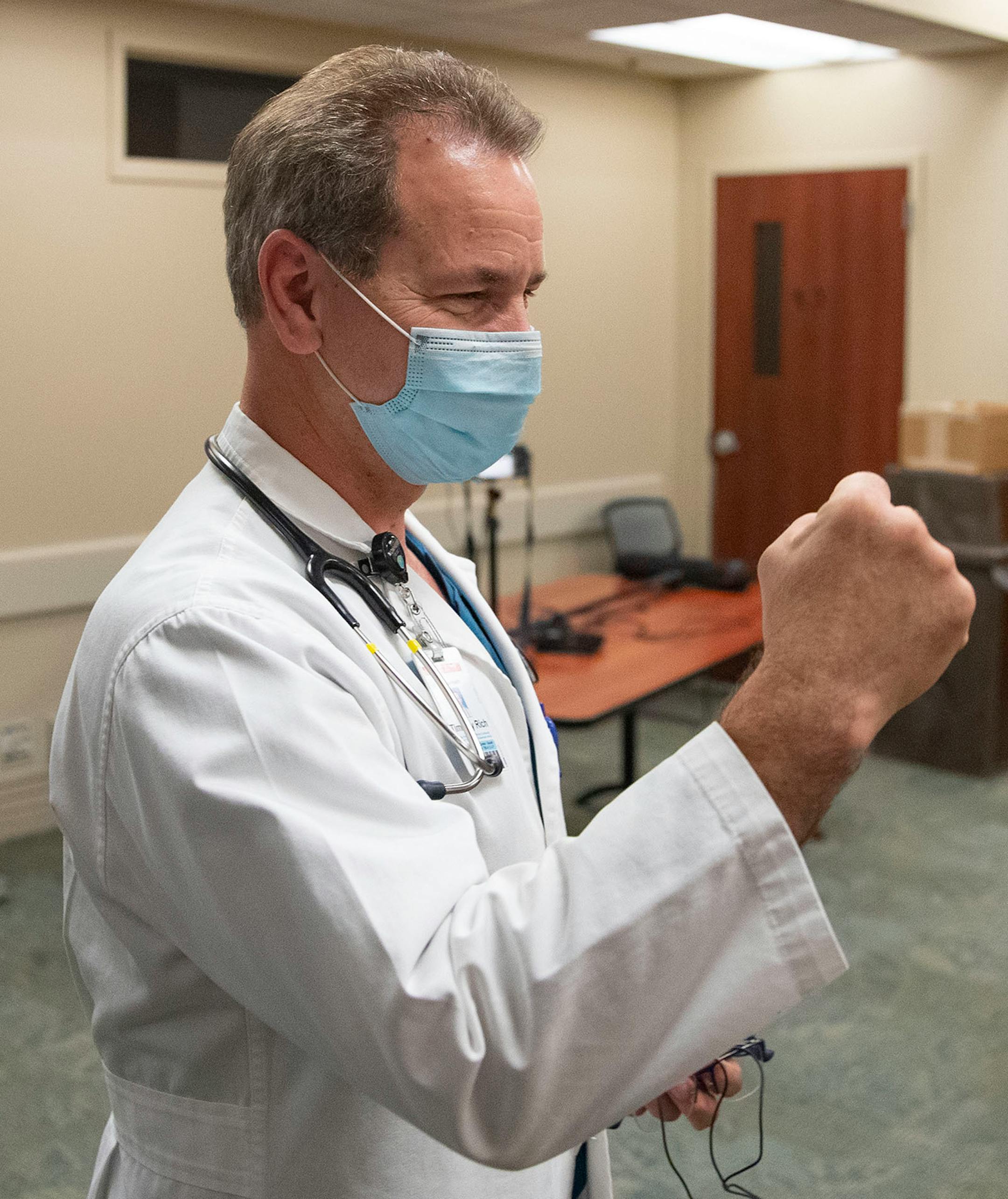 Dr. Tim Rich, M.D. from Essentia Health held up a fist in celebration as Bob Schlicht and Tim White spoke about their bounce back from ARDS at Essentia Health-St. Mary's Medical Center in Duluth on Friday October 16, 2020.