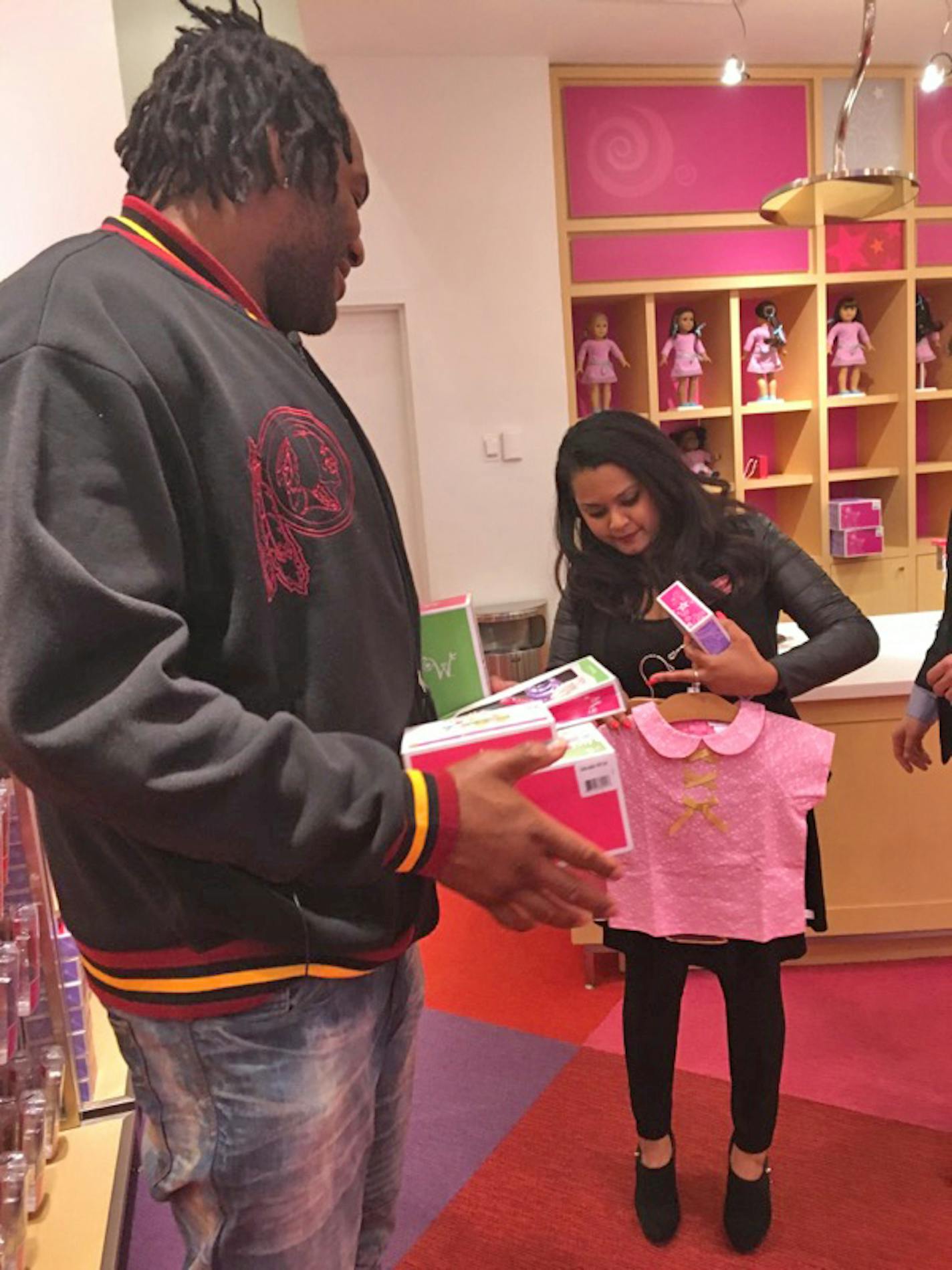 Washington Redskins player Ty Nsekhe purchases Christmas presents for 5-year-old Dae'Anne Reynolds, the daughter of Philando Castile's girlfriend, Diamond Reynolds. Castile was shot and killed by St. Anthony police officer Jeronimo Yanez on July 6, 2016 in Falcon Heights, MN.