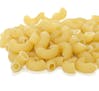 Pile of raw pasta gomito on white background. From istock