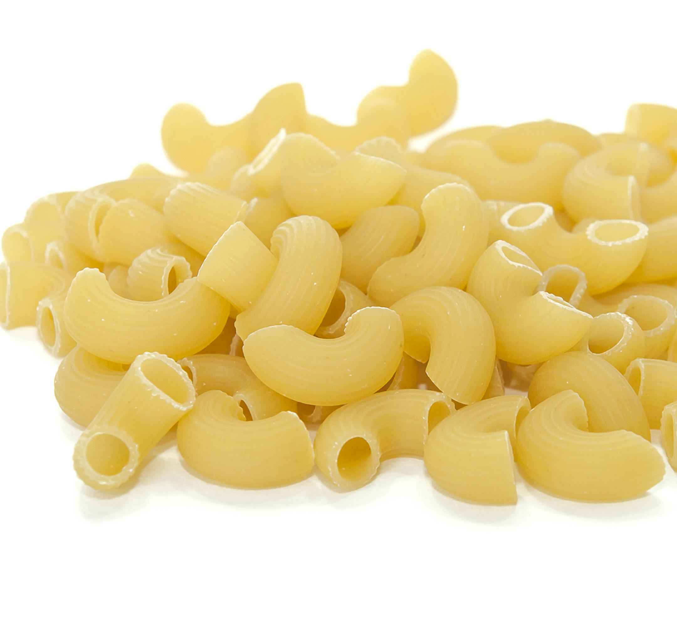 Pile of raw pasta gomito on white background. From istock