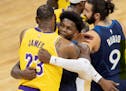 LeBron James (23) of the Los Angeles Lakers hugged Minnesota Timberwolves Anthony Edwards (1) at the end of the game.